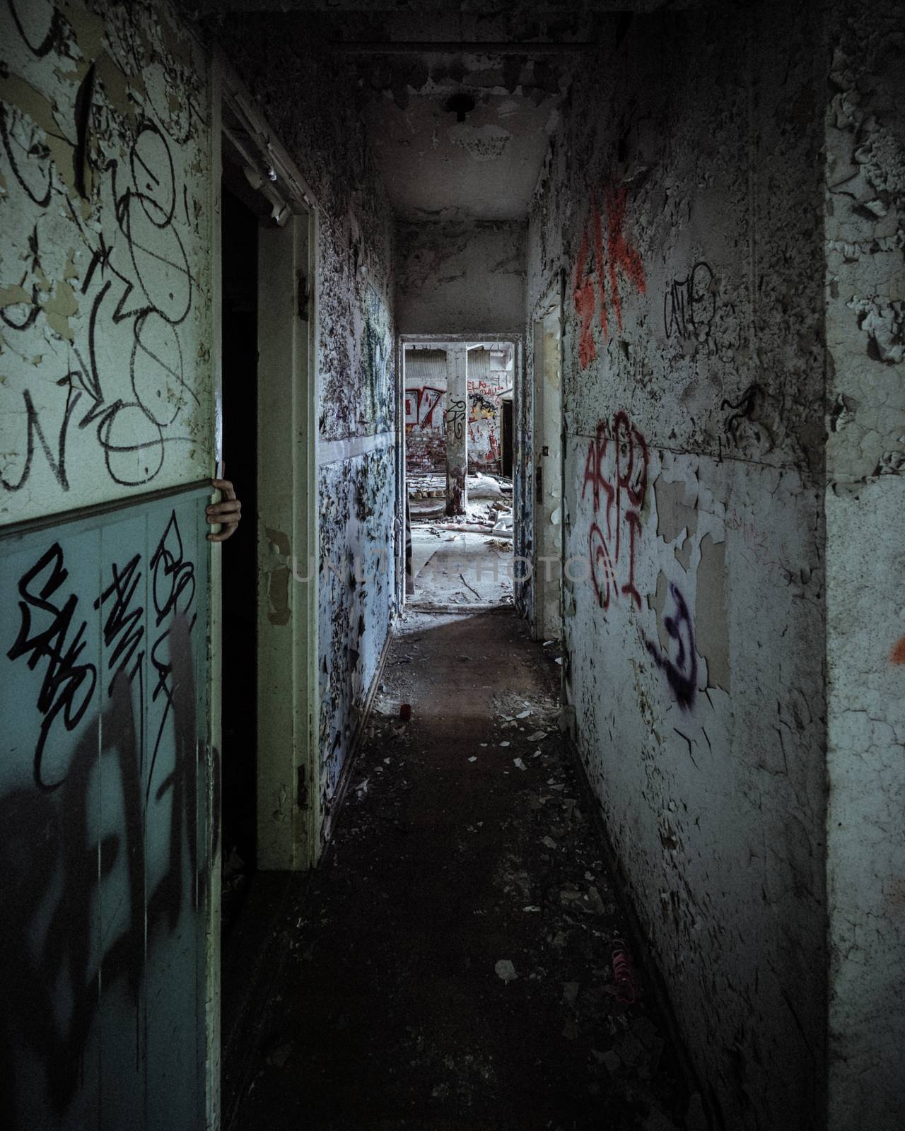 Scary abandoned corridor with hidden hand by juhku
