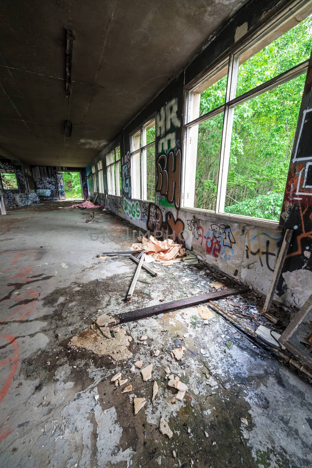 Abandoned factory hall and windows by juhku