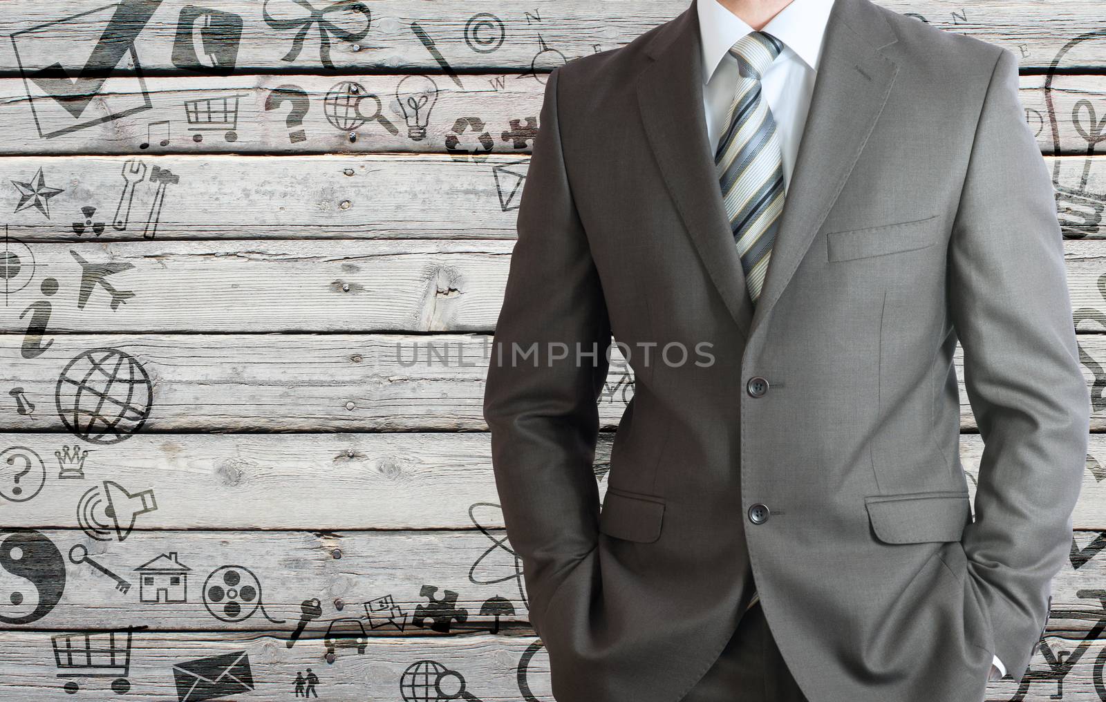 Businessman in a suit with background of various social icons on old wooden surface. Stylised frame