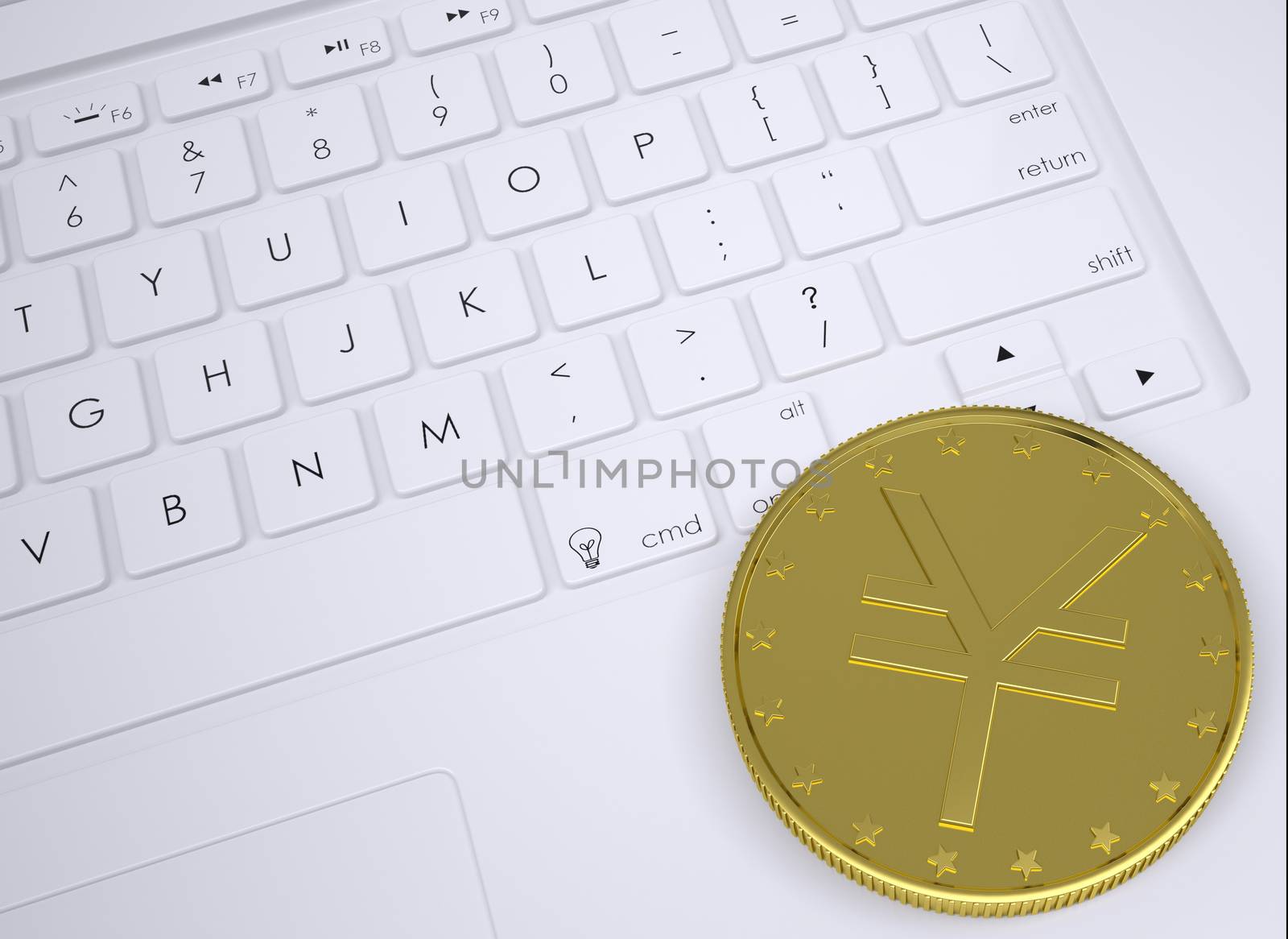 Gold yen coin on the keyboard. View from above