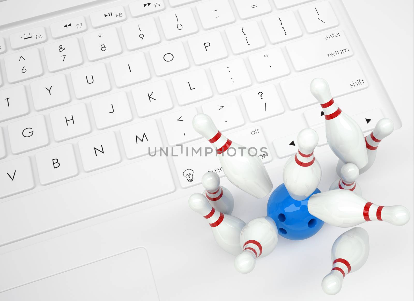 Bowling ball and skittles on the keyboard. View from above