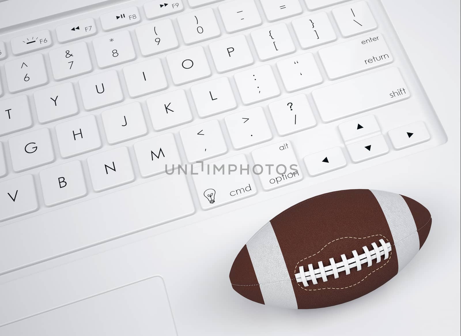 American football ball on the keyboard. View from above
