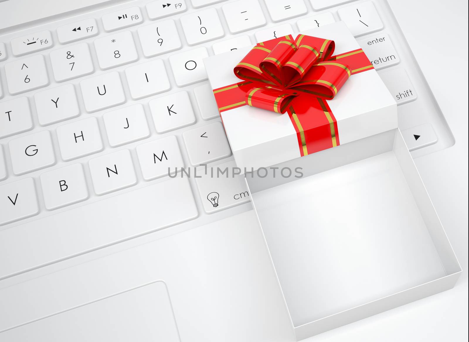 White open gift box lies on the keyboard by cherezoff