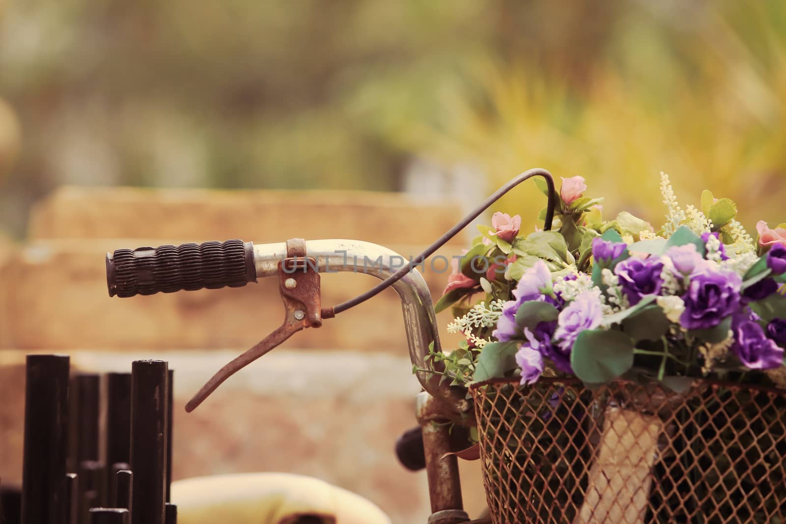 The bike basket with roses with retro filter effect