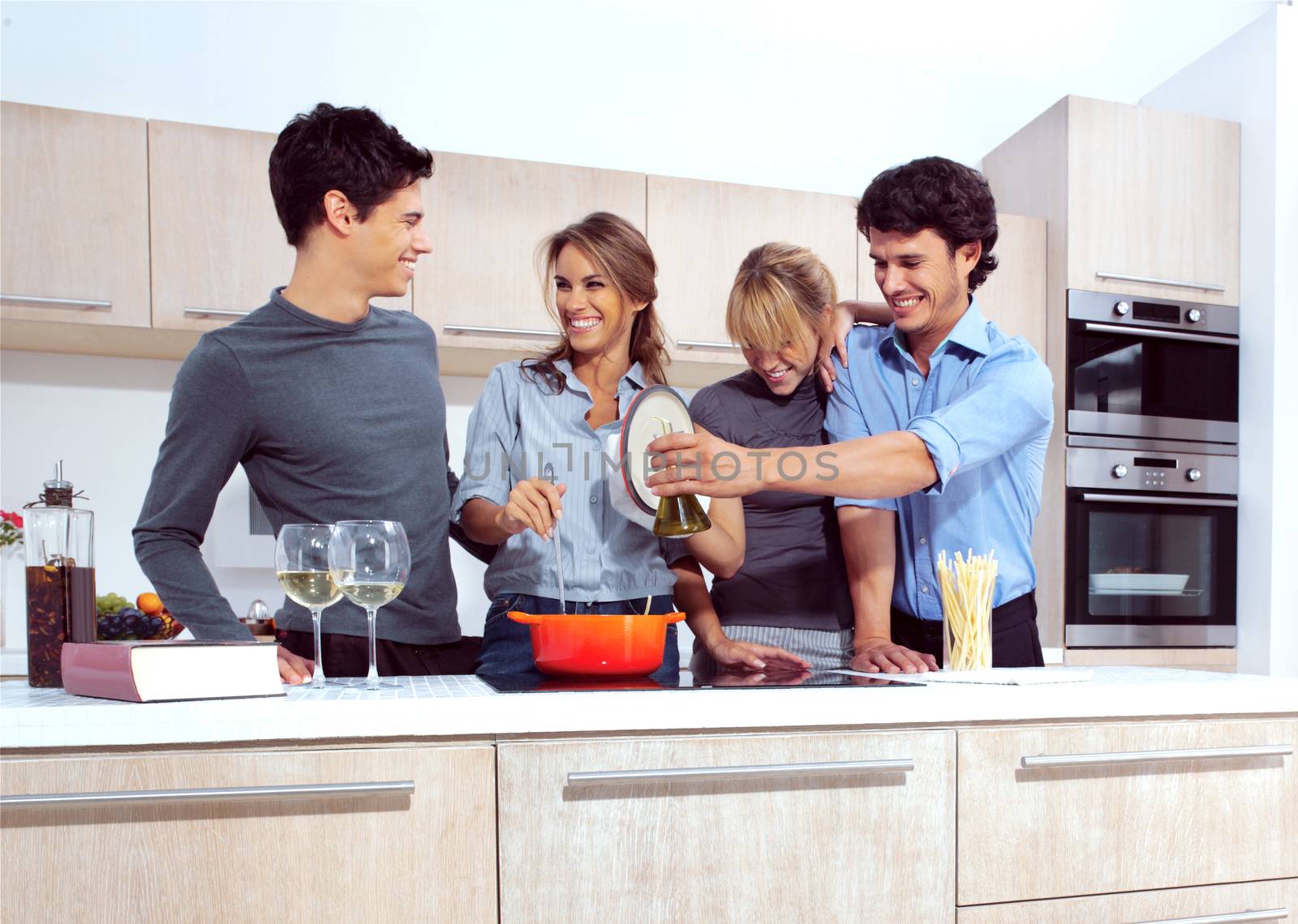 Attractive young people in the kitchen 