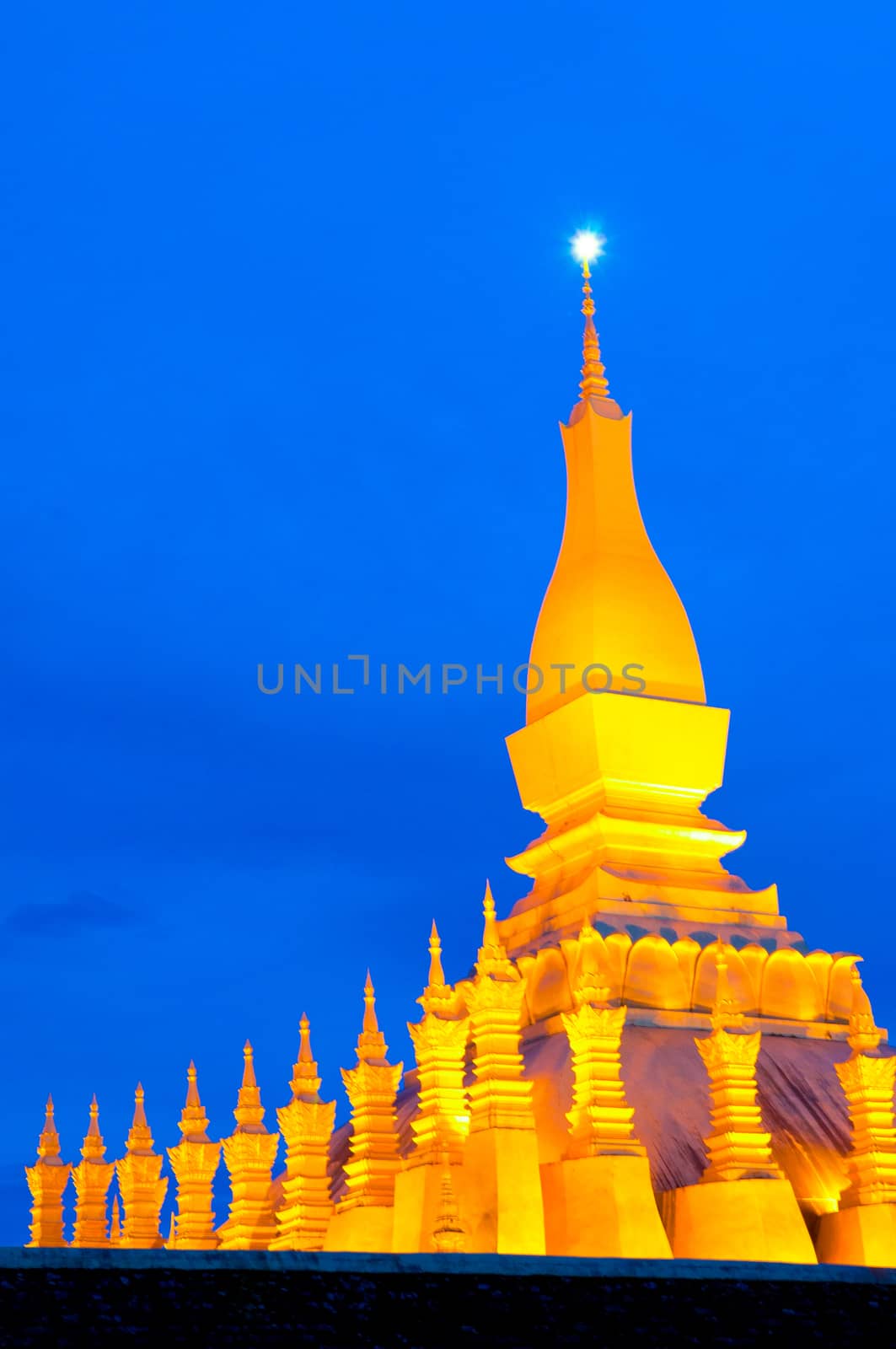 Pha That Luang, the golden stupa on the outskirts of Vientiane, Laos, that has become a national symbol for the nation. Photo taken during sunrise.