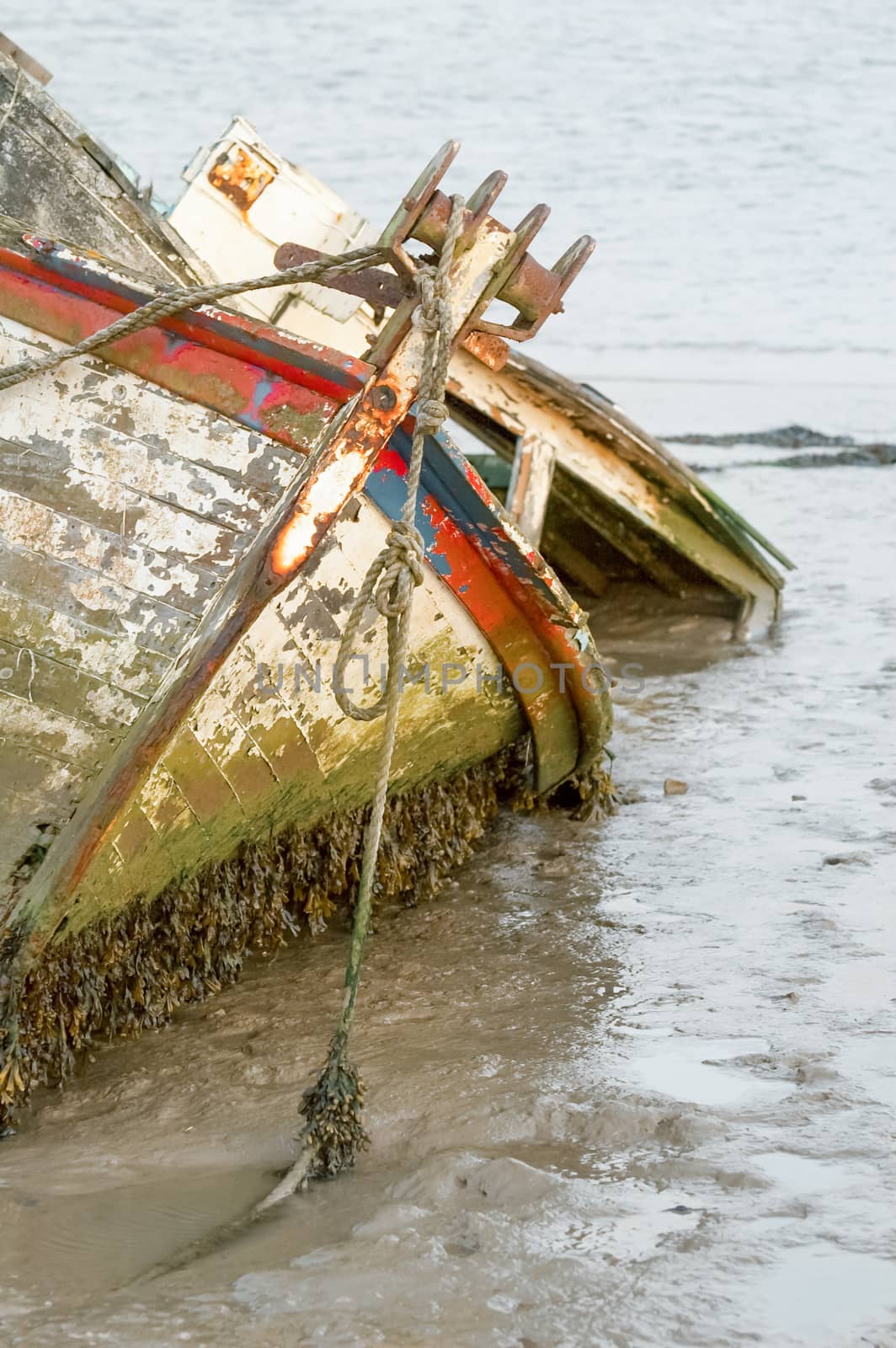 fishing boat wreck stranded in tidal mud