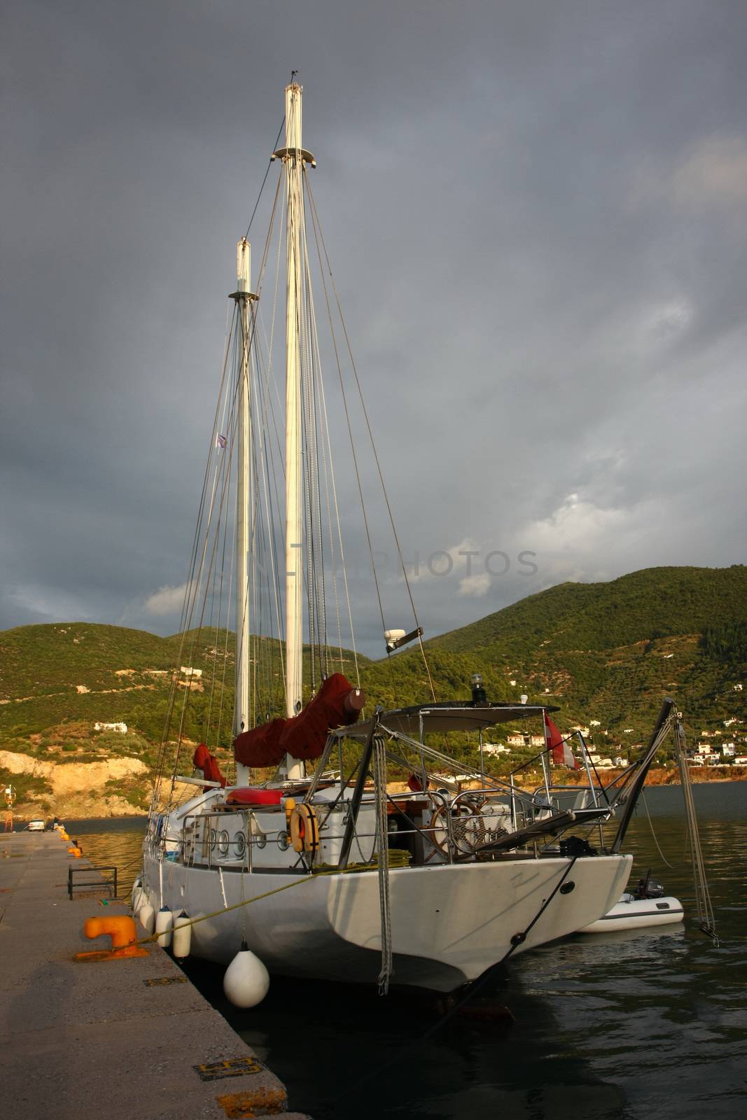 Sailboat in Skopelos town marina on Greek island Skopelos, after the storm