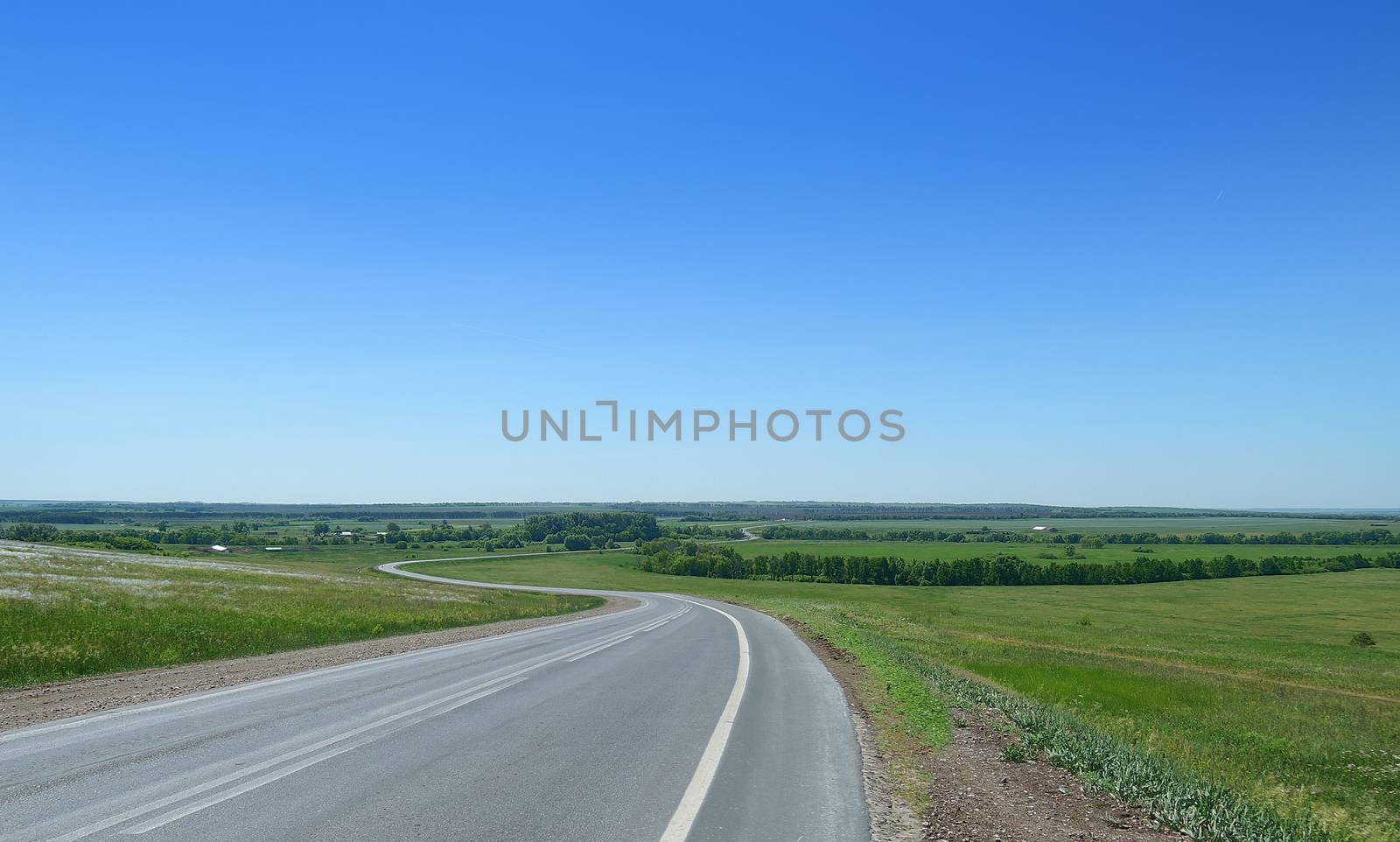 winding road in the countryside in summer  by butenkow