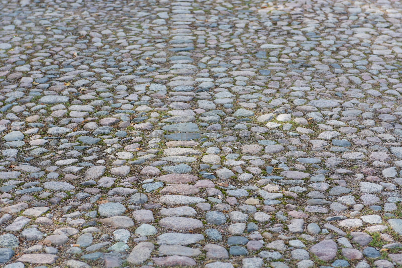 Background of an old cobble stone pavement with line pattern