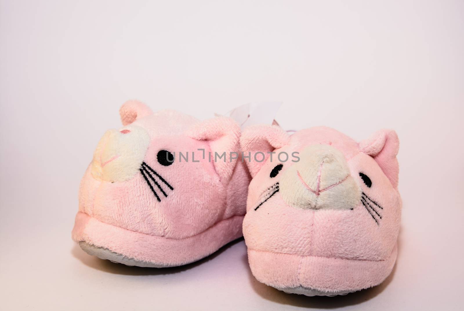 The isolated baby shoes on the white background.