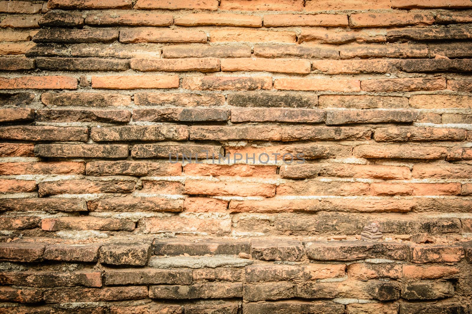 An old brick wall for a background purposes and other.