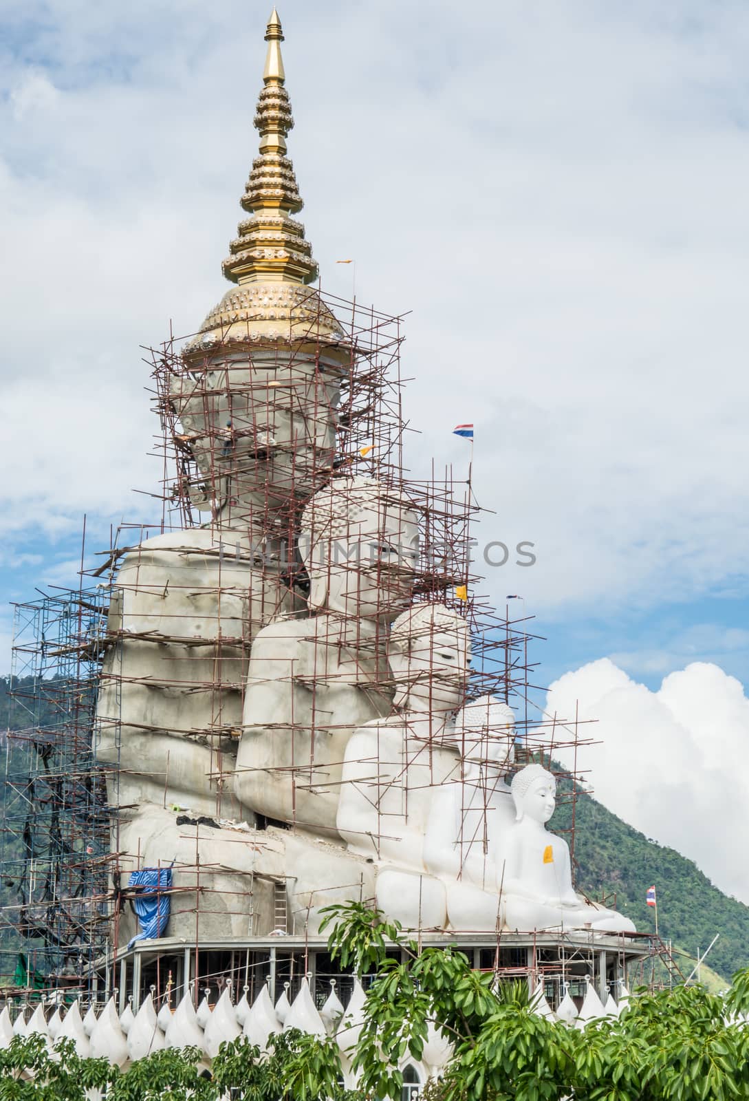 four buddhas sitting waiting to finish the constructing