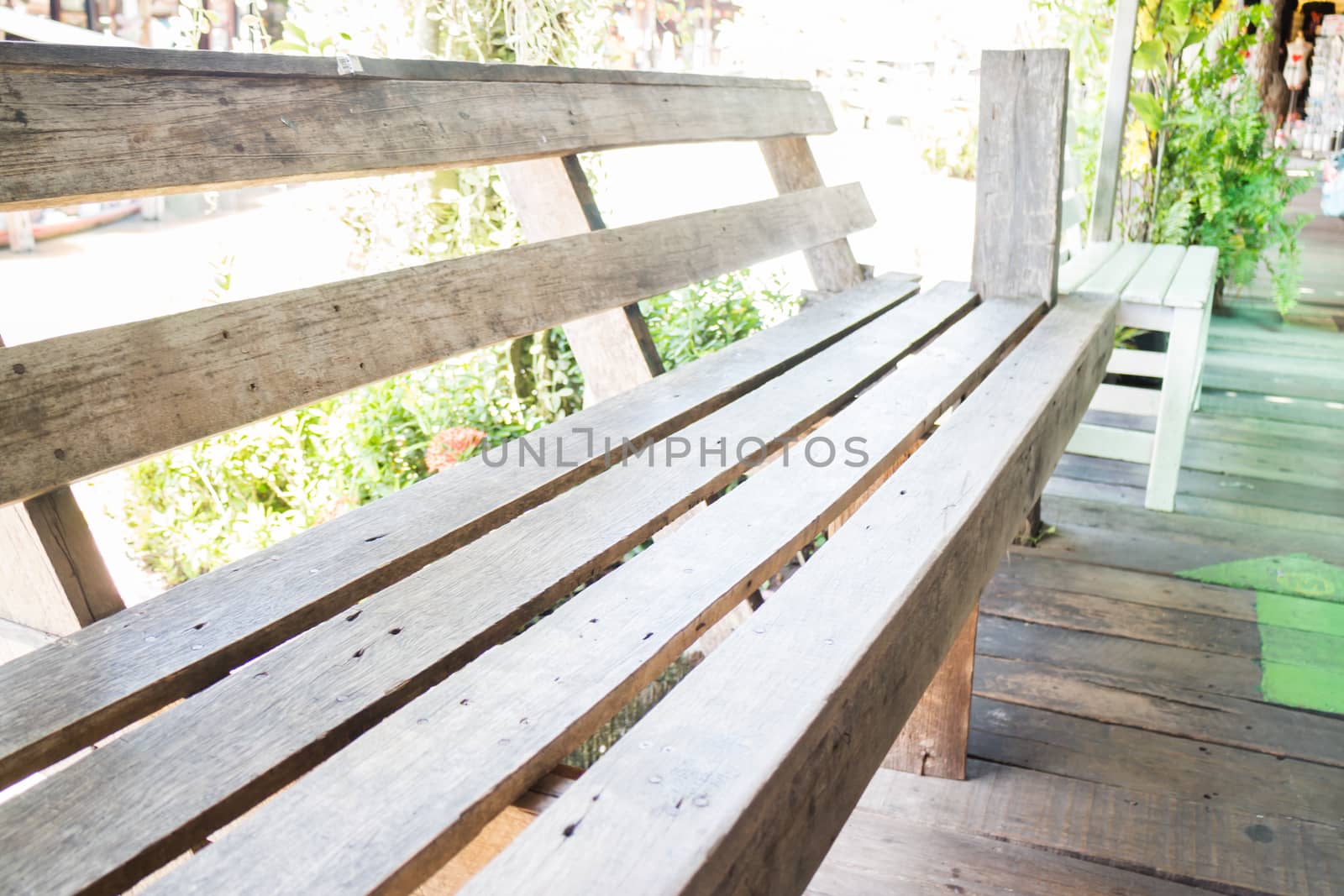 Wooden bench along the way by punsayaporn