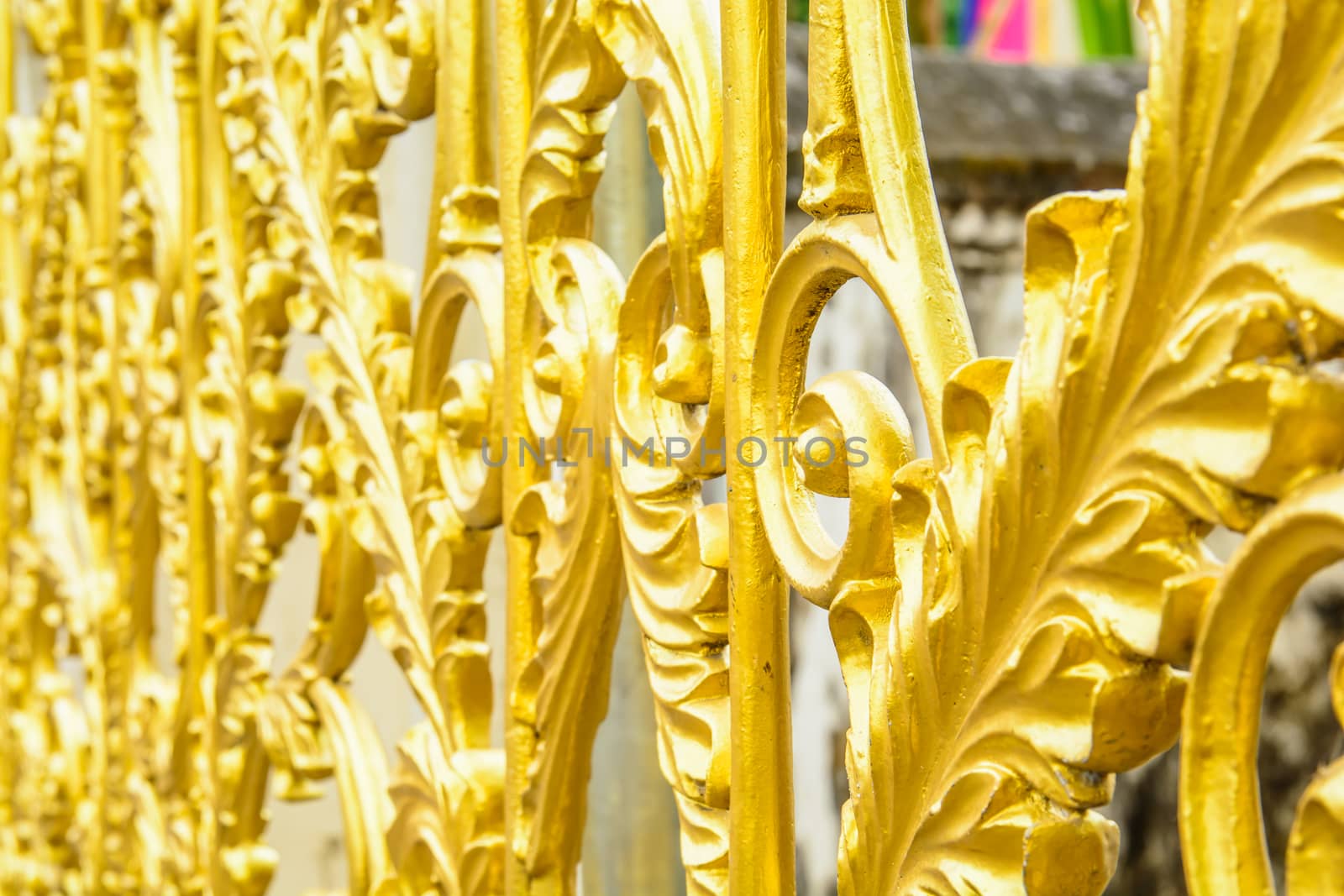 the golden metal fence of property protection. colorful metal fence.