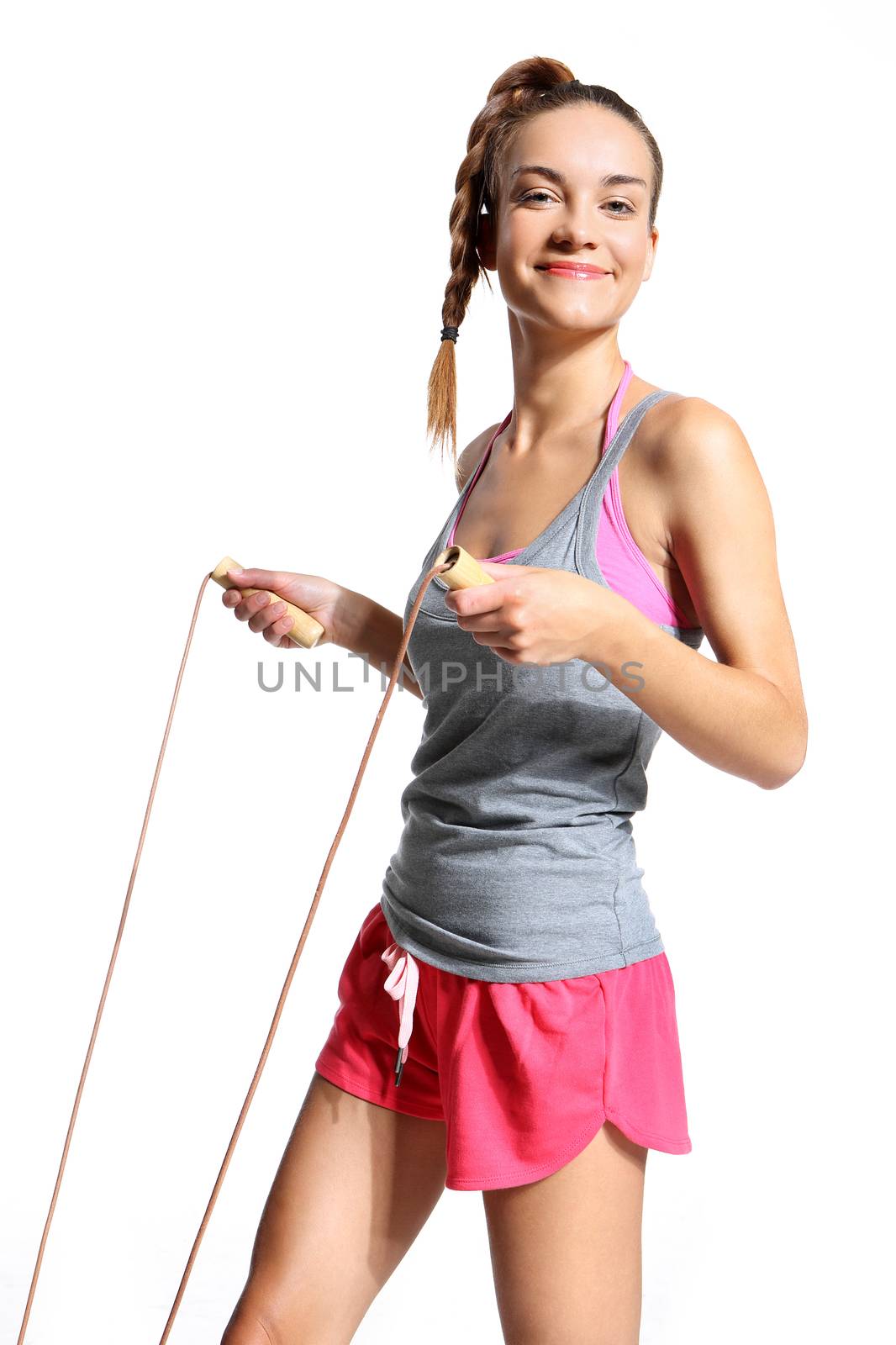 energetic woman jumping rope by robert_przybysz