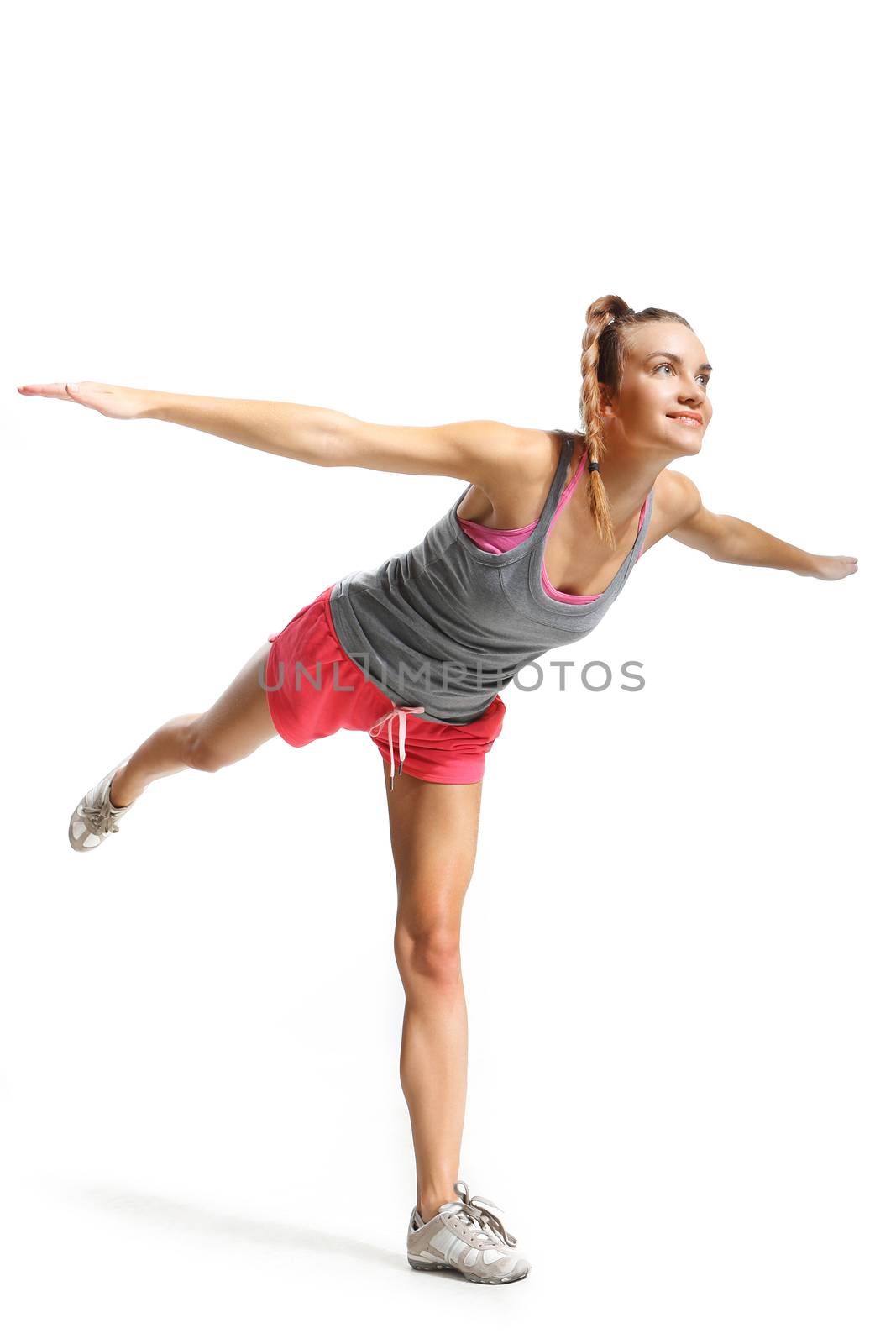 beautiful woman doing balance exercises swallow