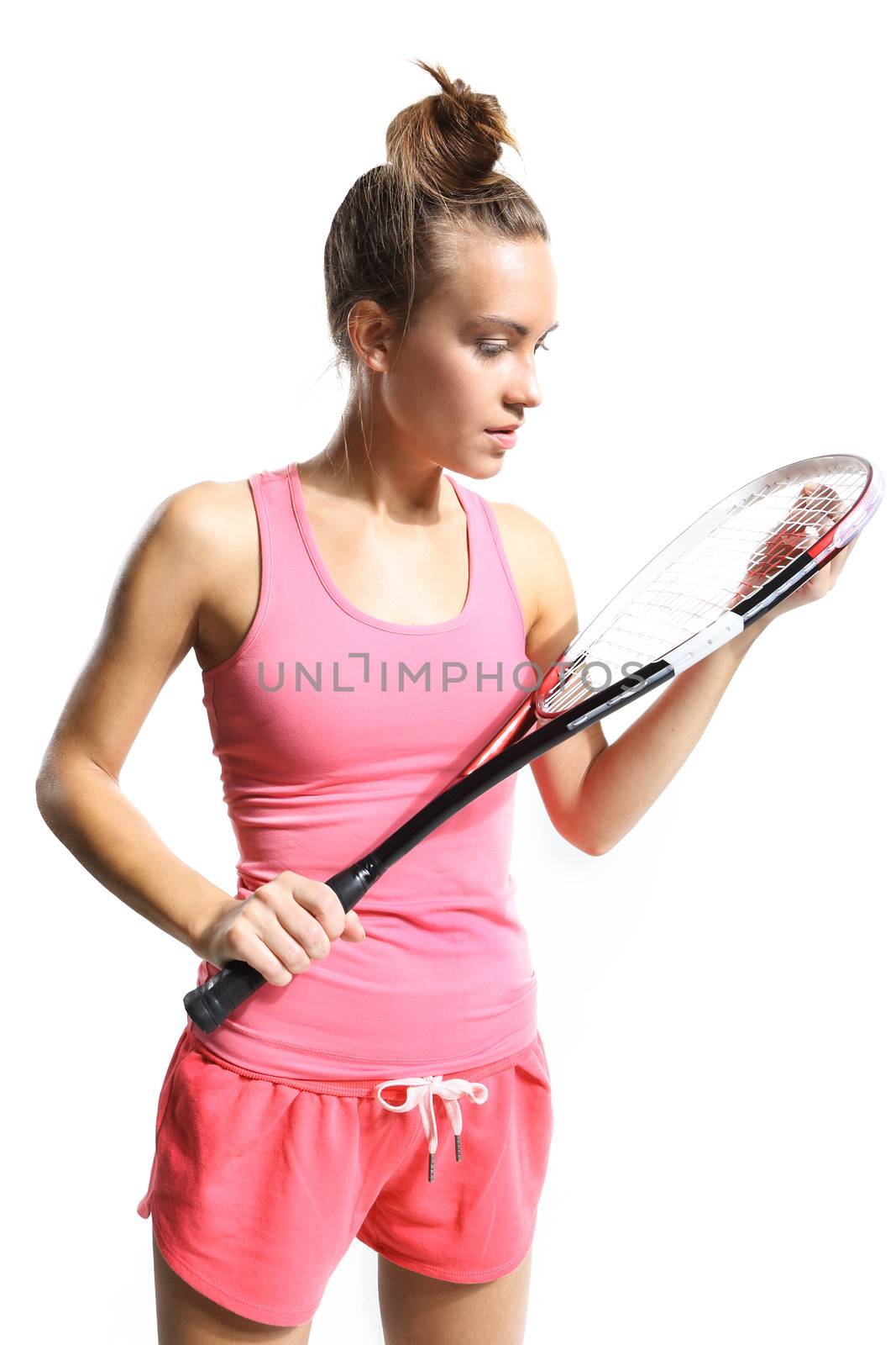 Beautiful athletic woman with squash racket
