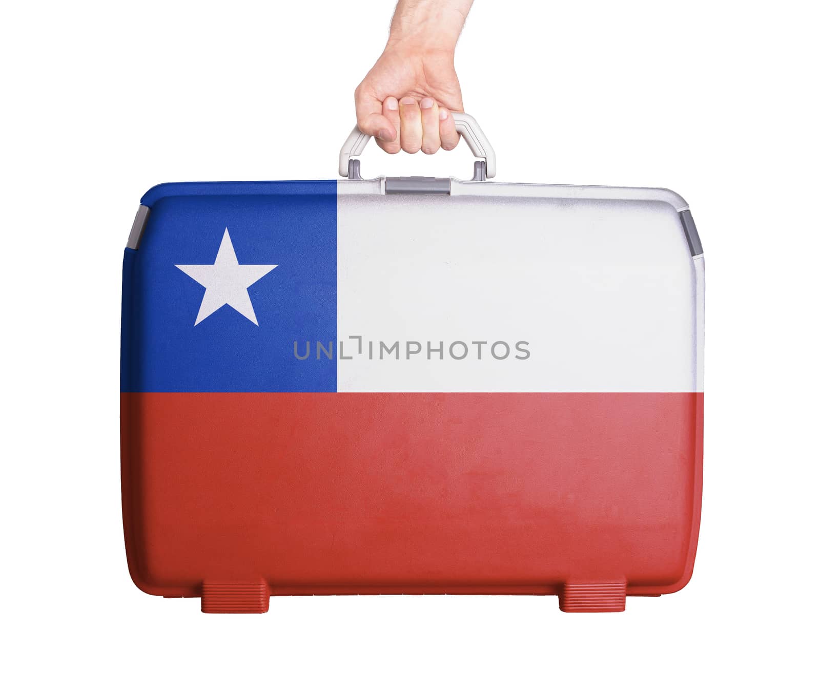 Used plastic suitcase with stains and scratches, printed with flag, Chile