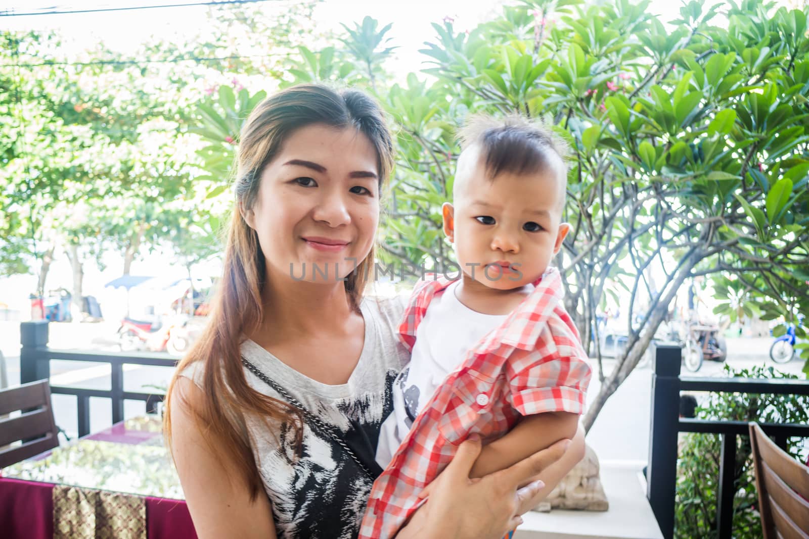 Asian cute boy pose with his mother, stock photo