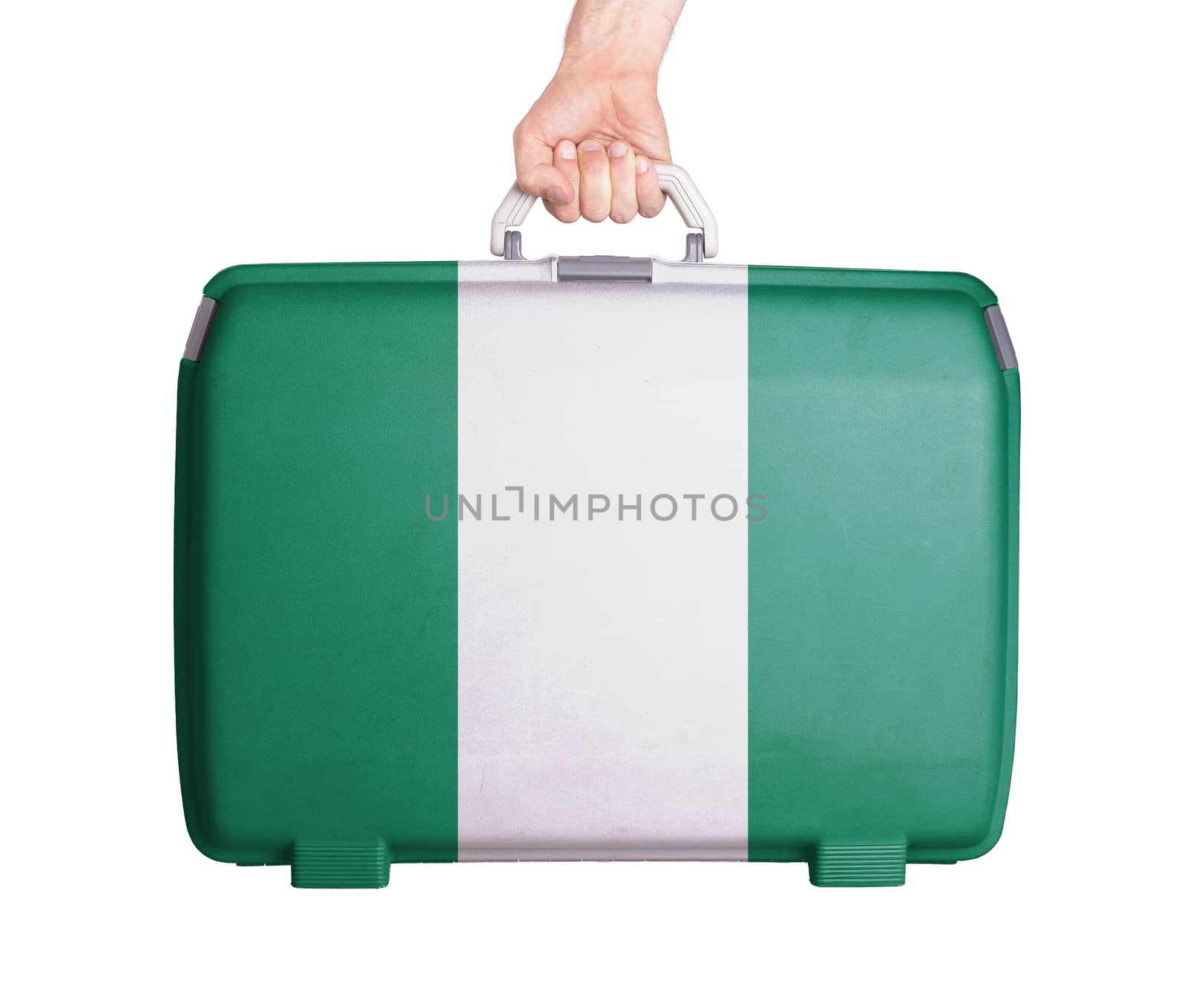 Used plastic suitcase with stains and scratches, printed with flag, Nigeria