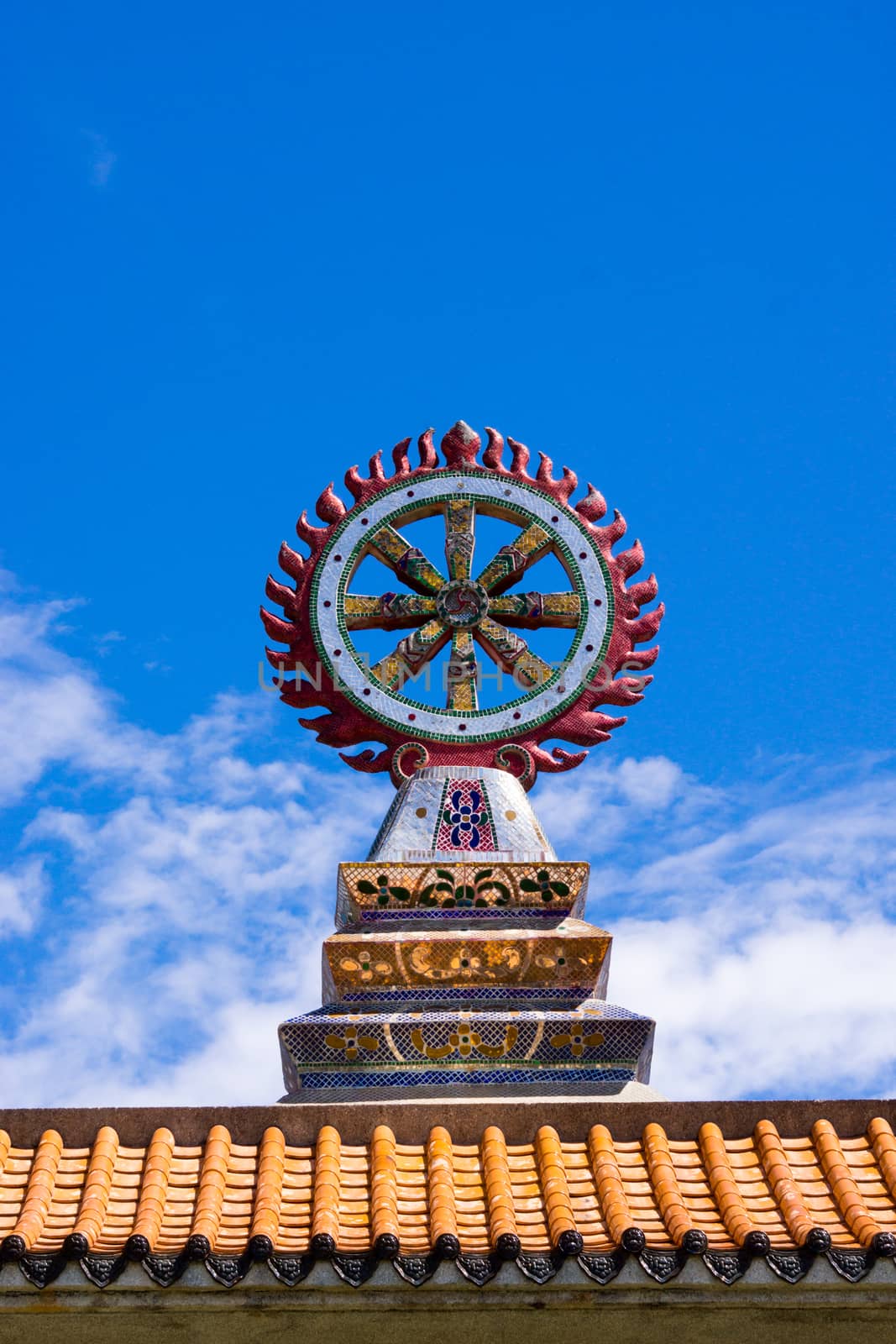 Wheel of the low on blue sky by nattapatt