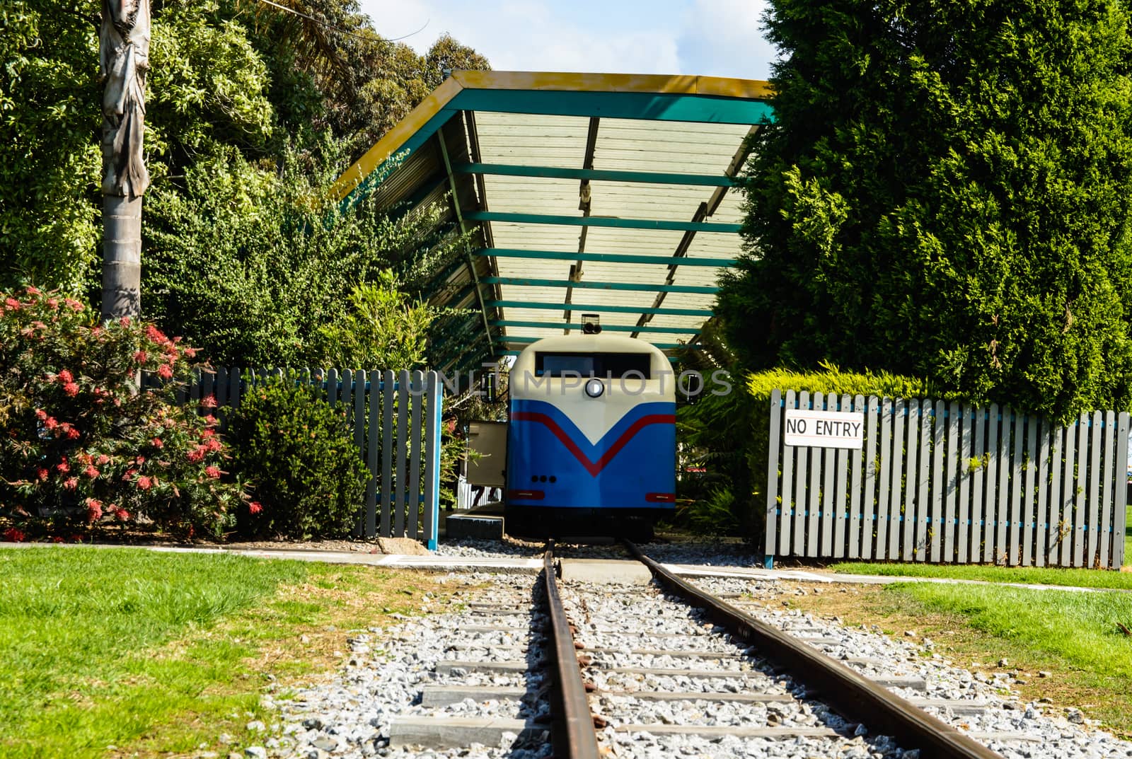 The train has just arrived to drop kids at the fun park train station.