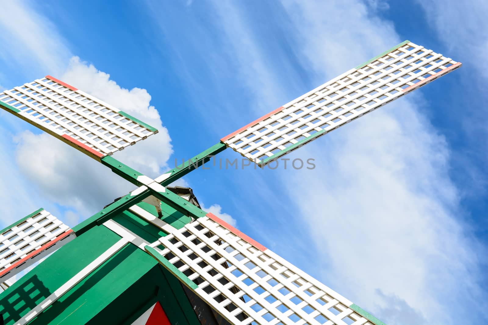 old style wind turbine stands on the sunny day