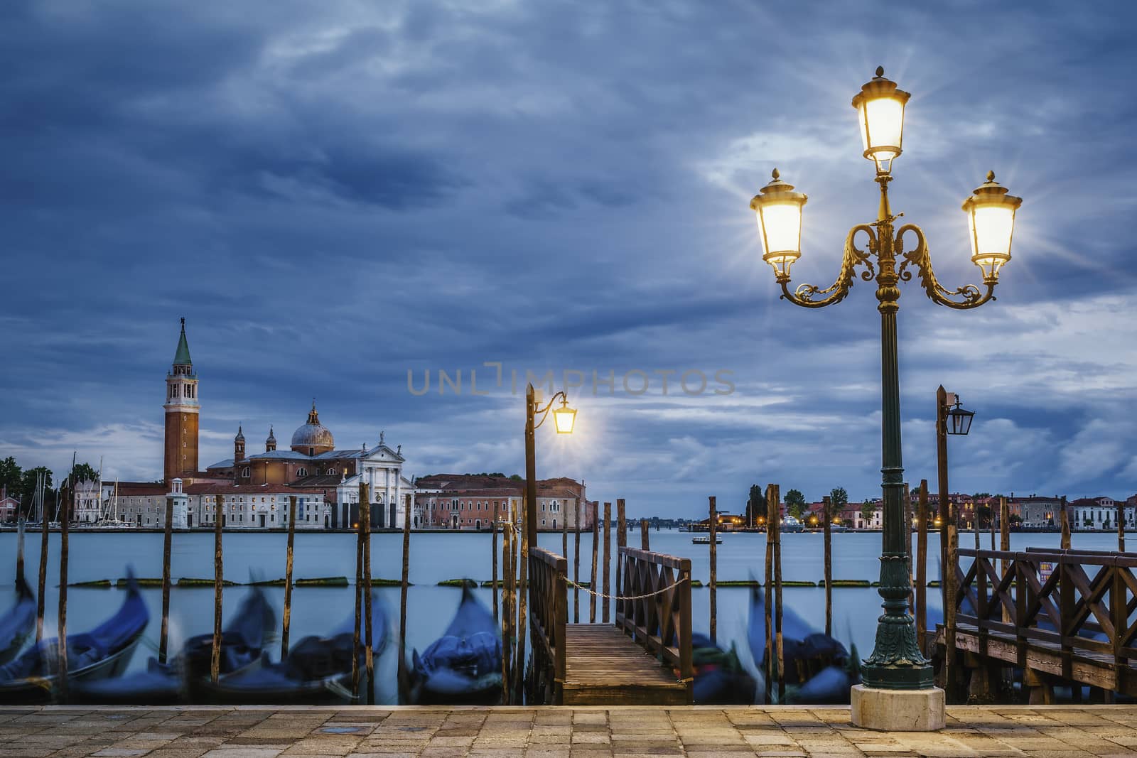 Gondolas floating in the Grand Canal after sunset