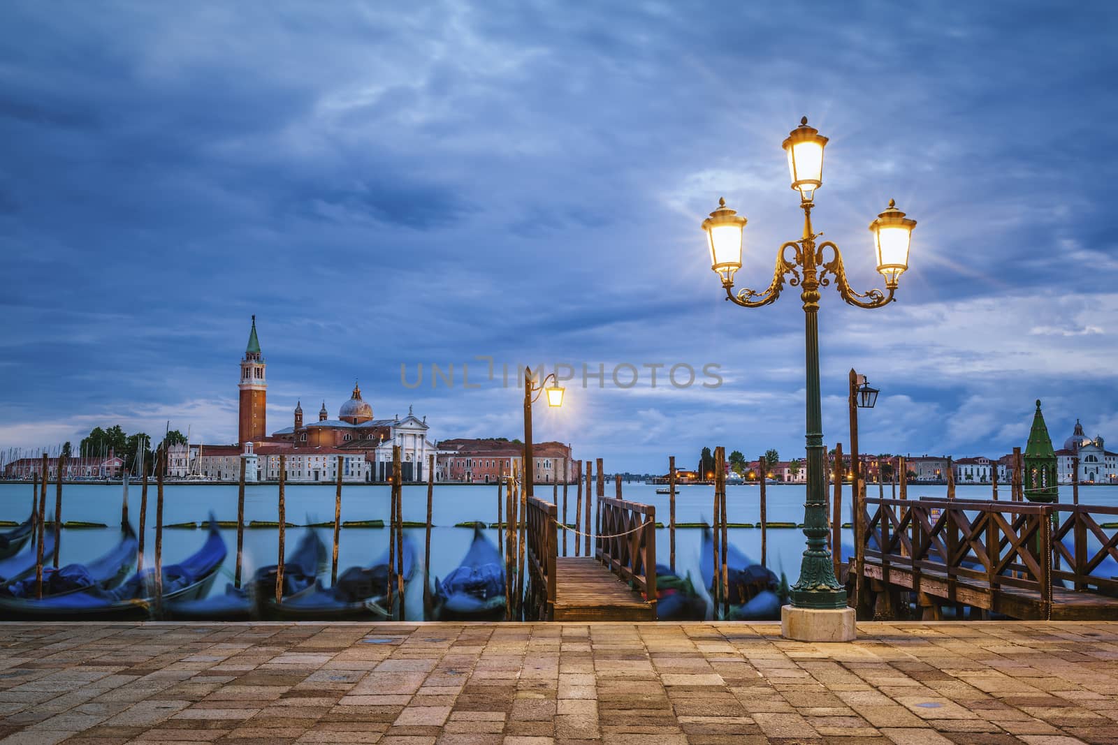 Gondolas floating in the Grand Canal after sunset