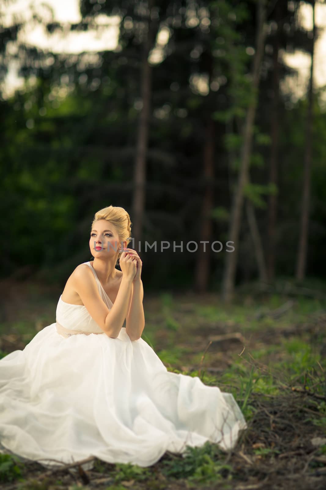 Lovely bride outdoors in a forest