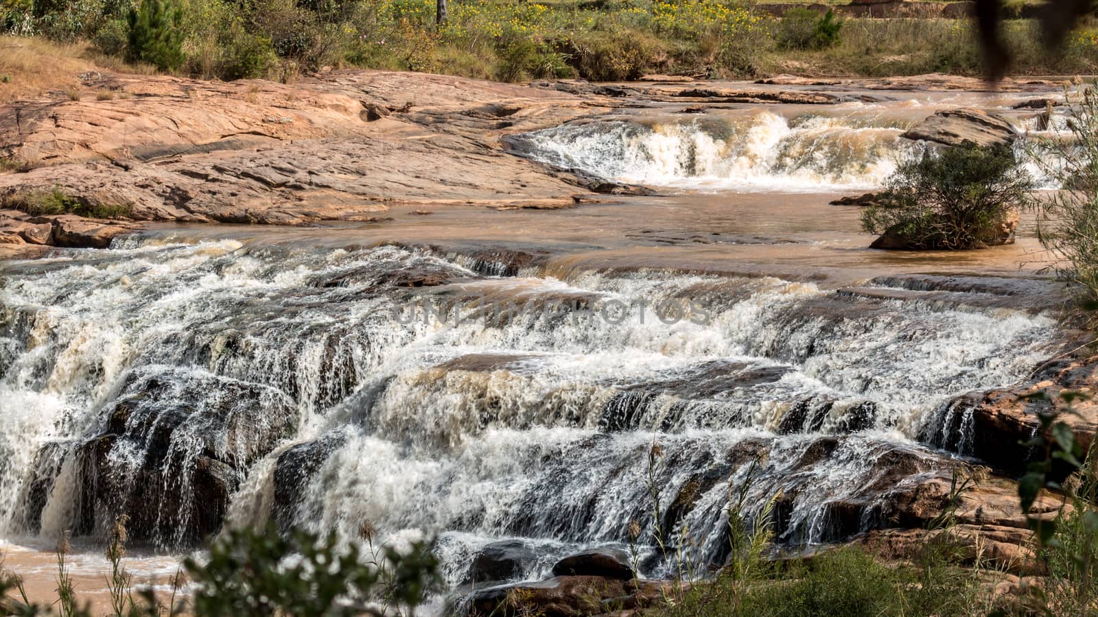 Beautiful and tranquil landscapes of Madagascar with multiple levels of small waterfalls