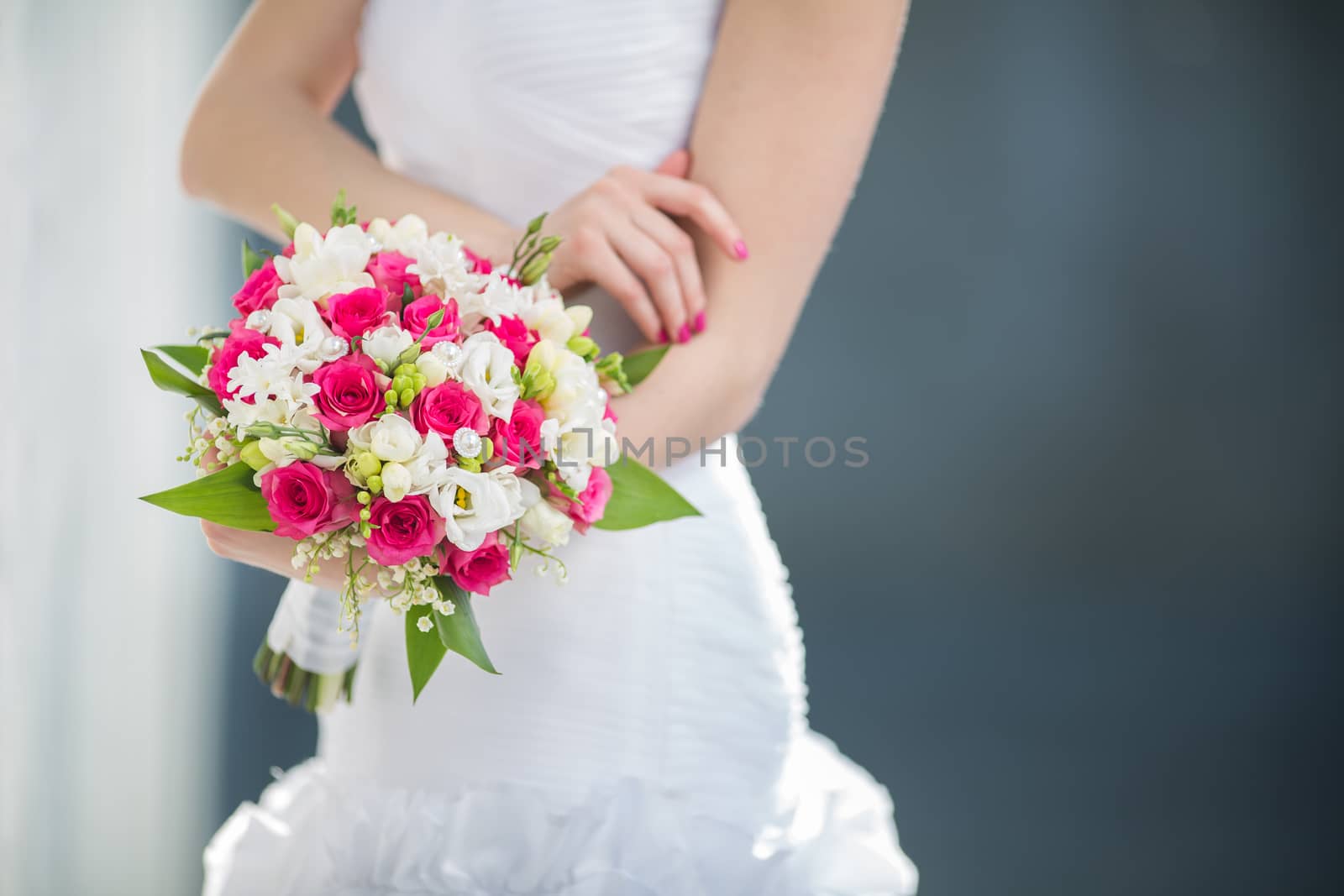 Beautiful wedding bouquet in hands of the bride by viktor_cap