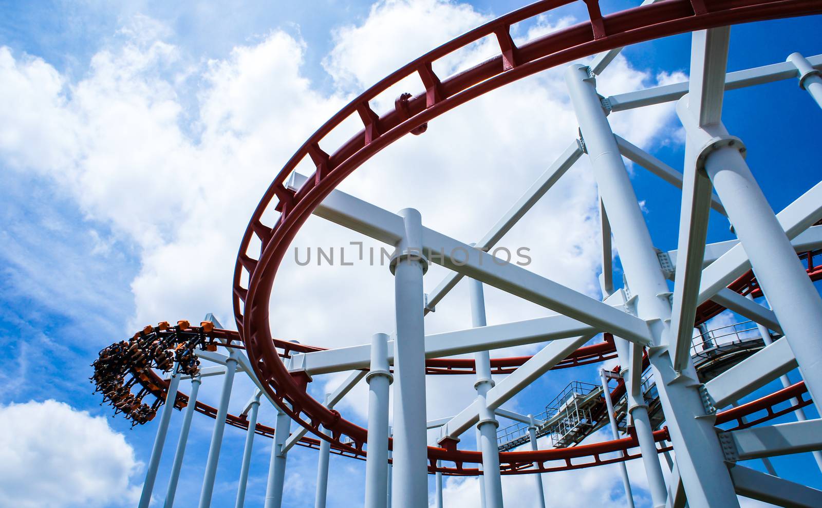 Rollercoaster ride with sky at theme park