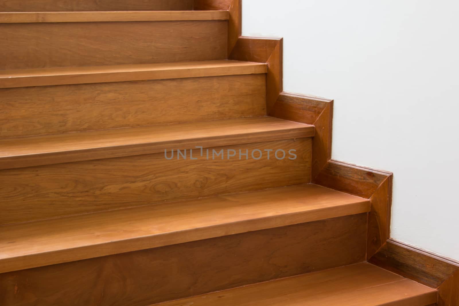 Staircase with wooden steps with building interior