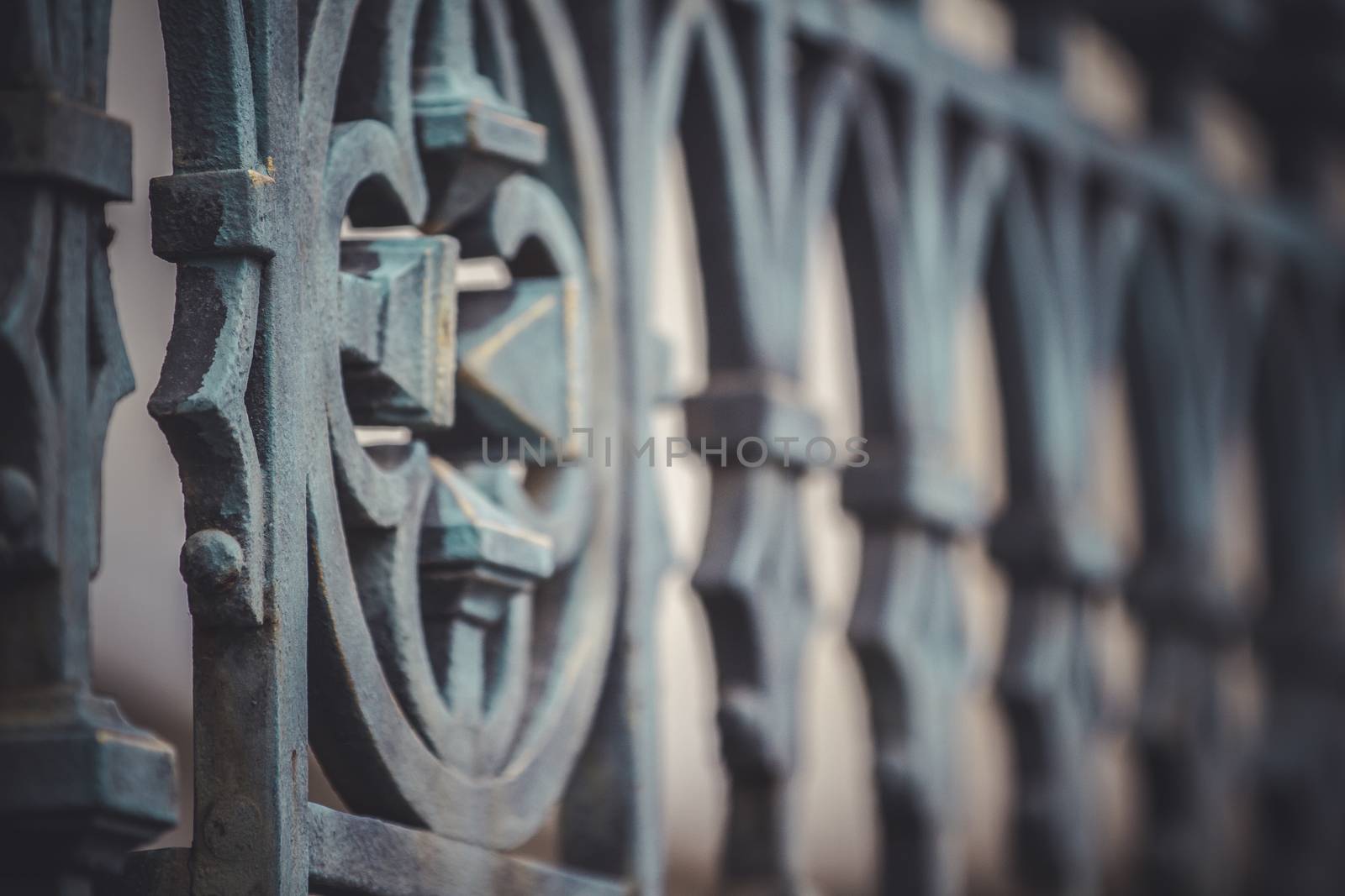 iron cross, fence with decorative metal flourishes by FernandoCortes