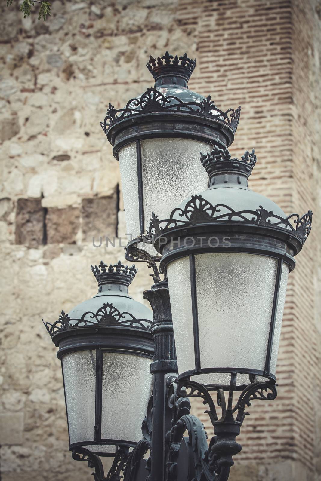 europe, traditional street lamp with decorative metal flourishes by FernandoCortes
