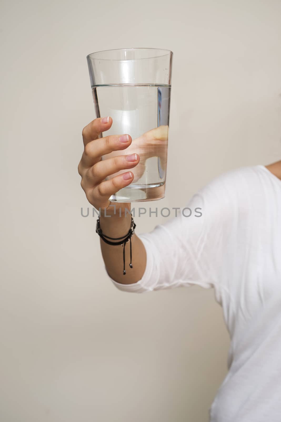 hand holding a glass of water