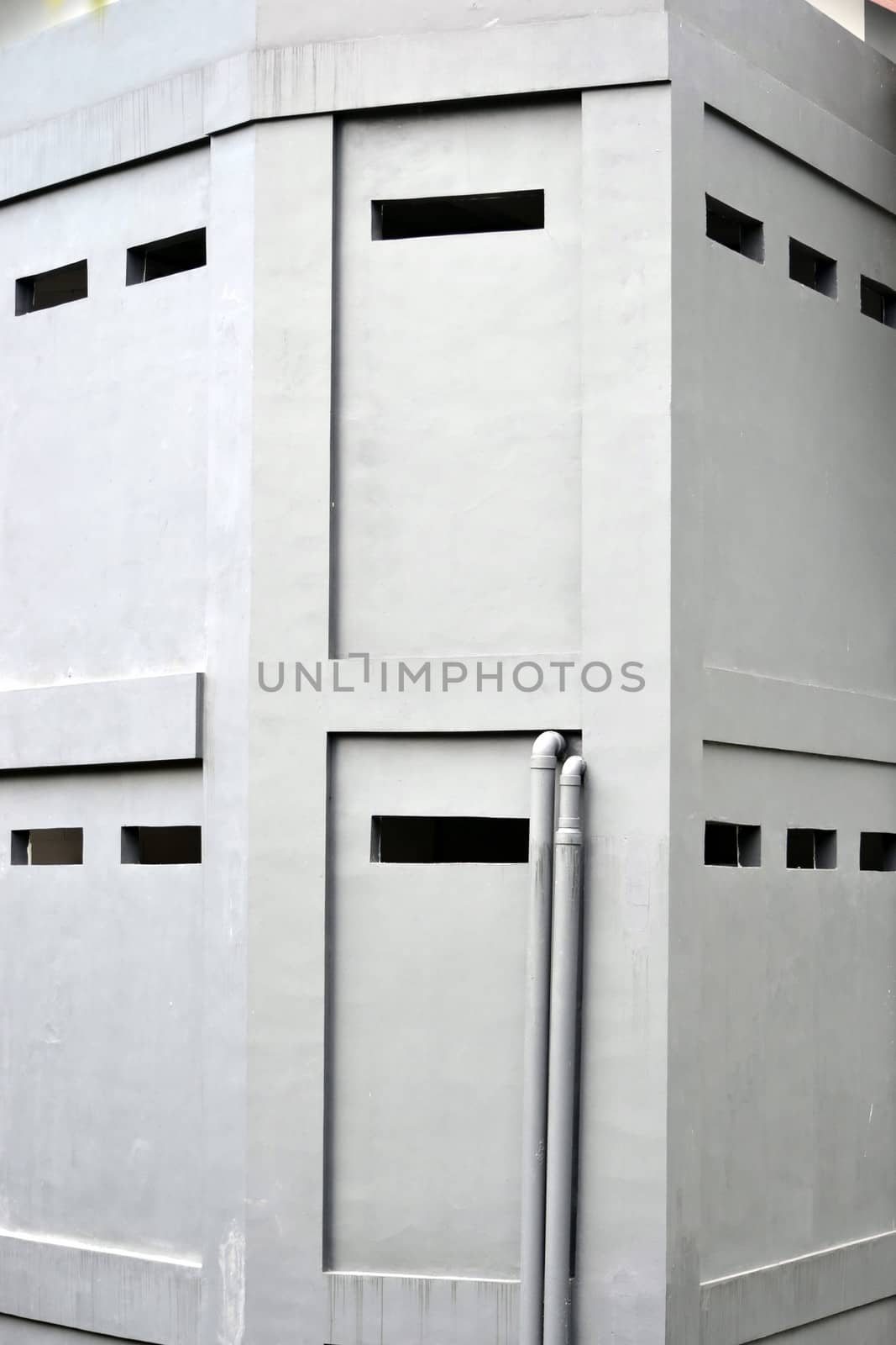 grey concret wall that built on residential building