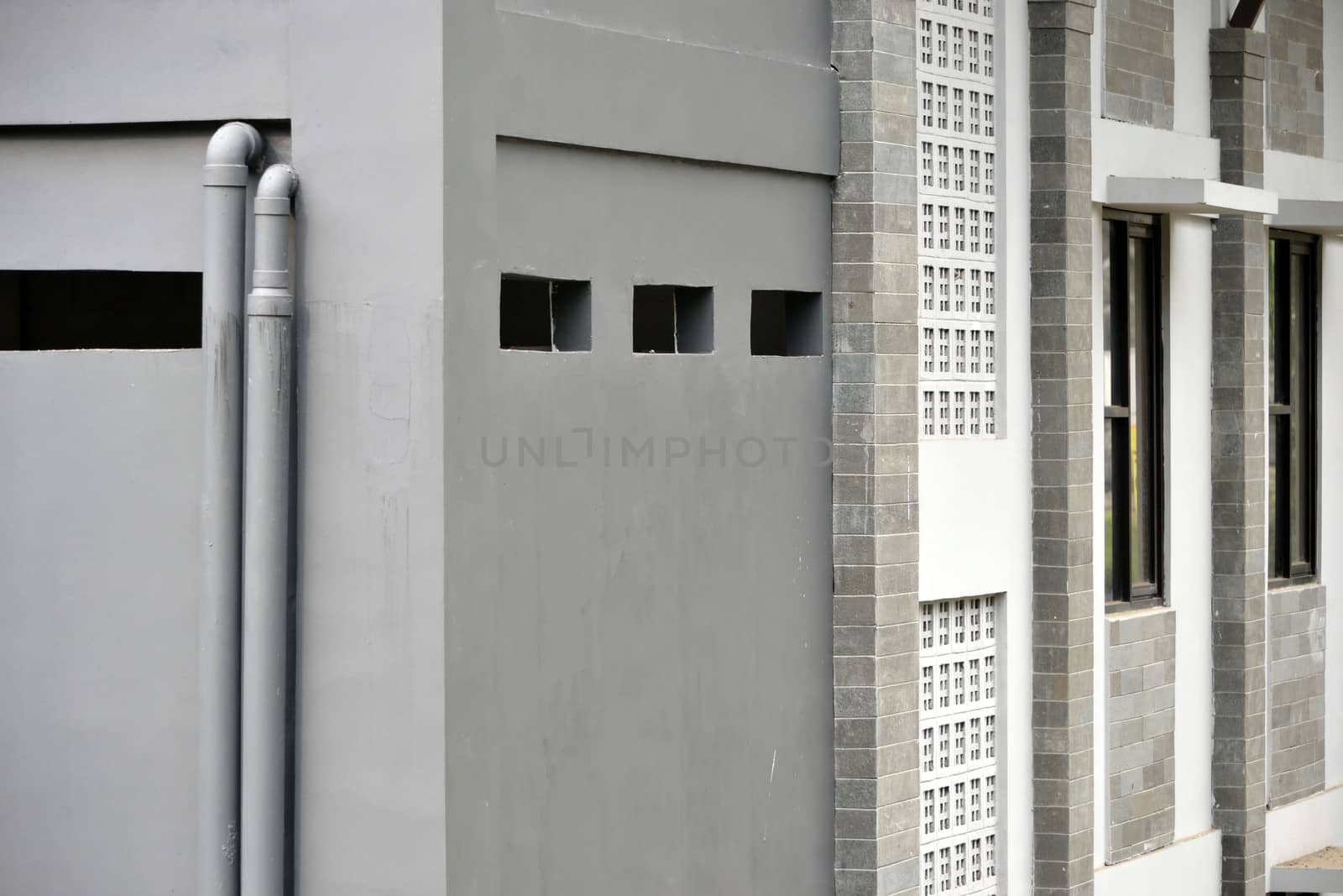 grey concret wall that built on residential building