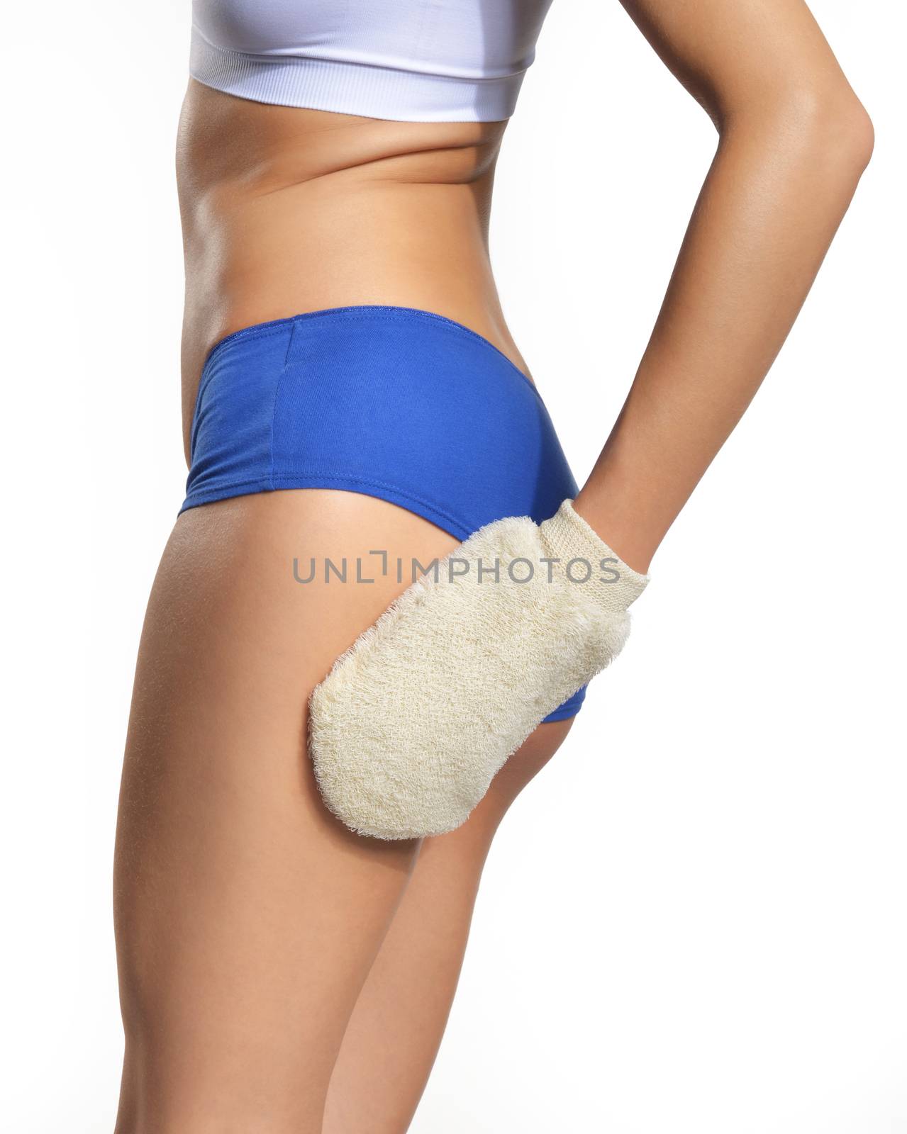 Young happy woman massaging her thigh with sisal glove isolated on white background