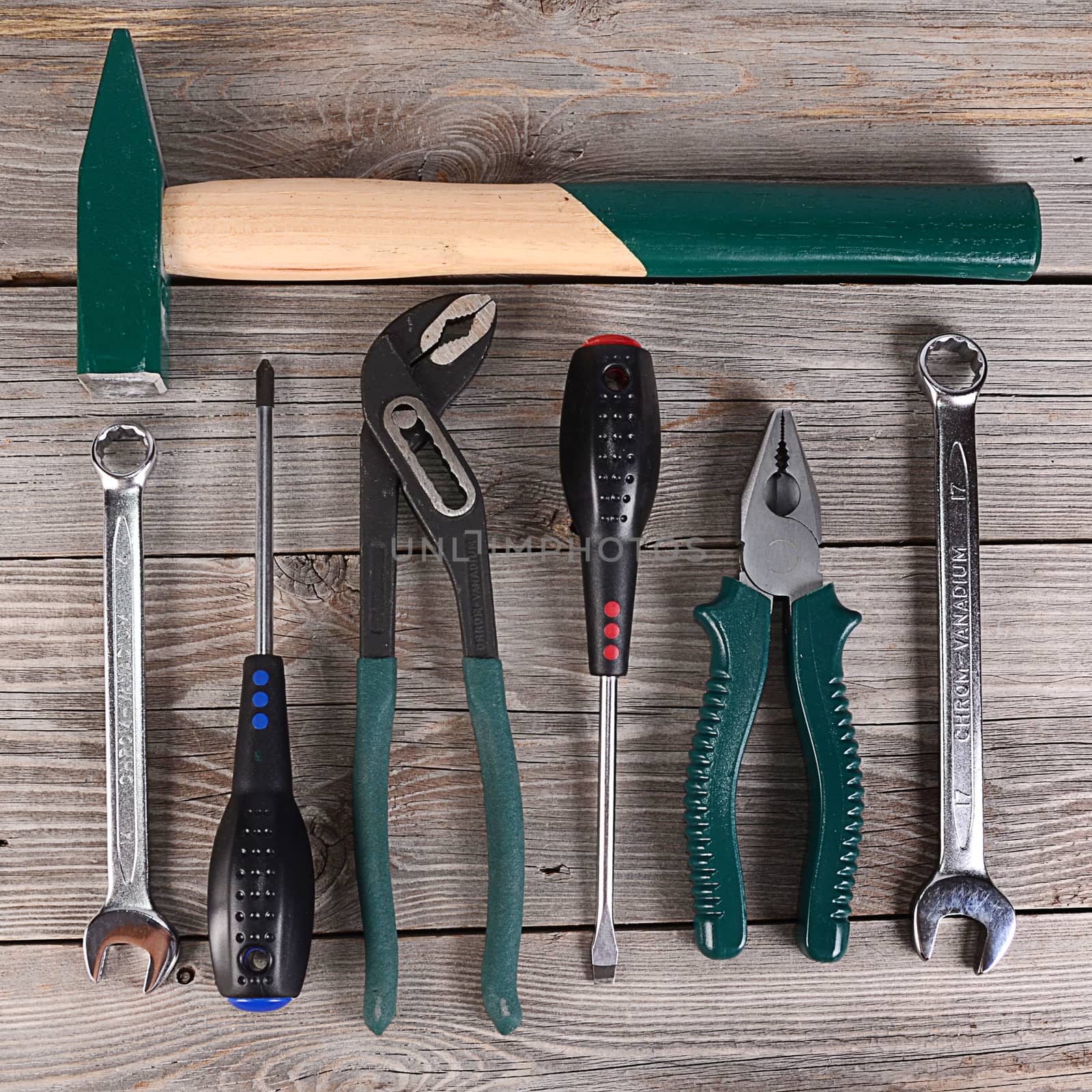 Tools for repair on a wooden background