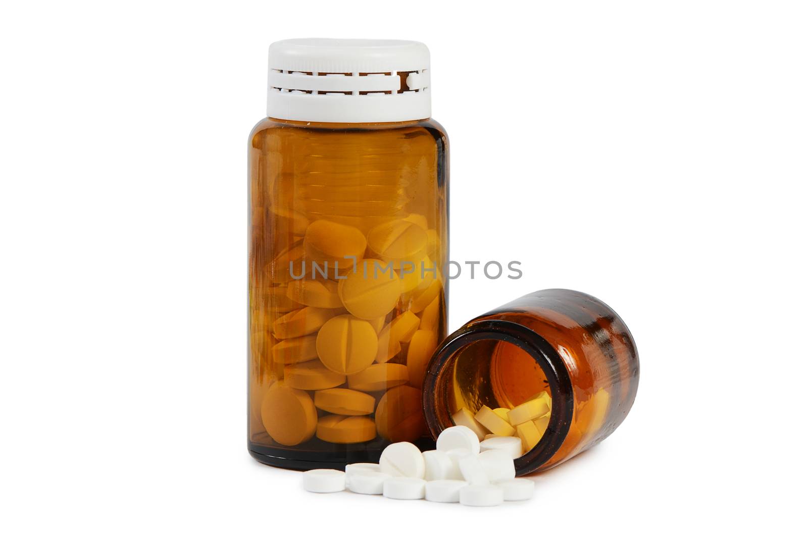 Tablets to a glass jar  on white