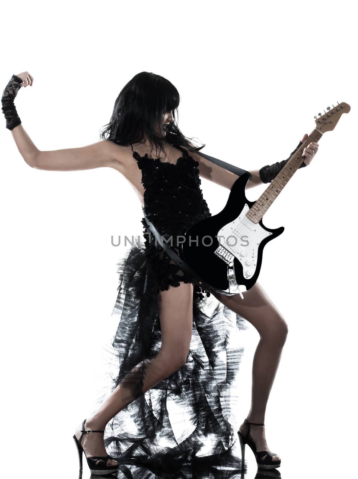 one woman playing electric guitar on studio isolated white background