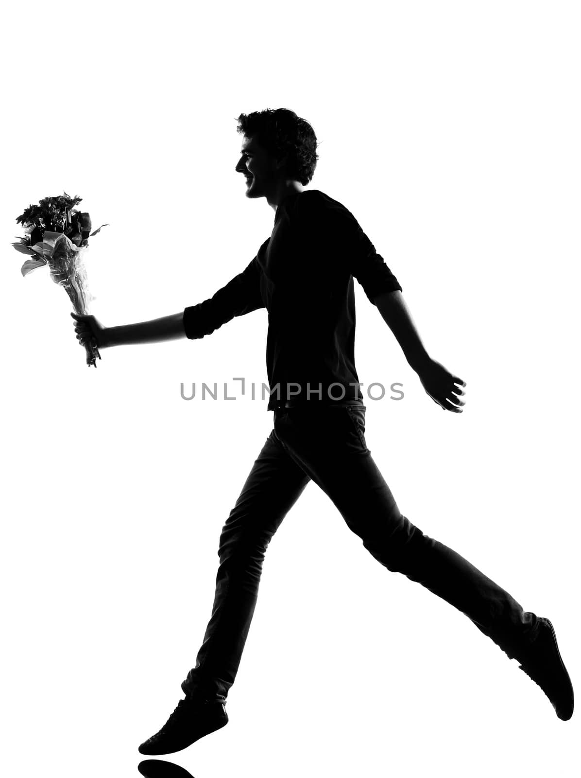 young man offering flowers bouquet silhouette in studio isolated on white background