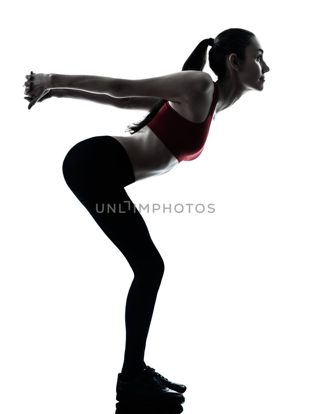 one  woman exercising stretching arms in silhouette studio isolated on white background