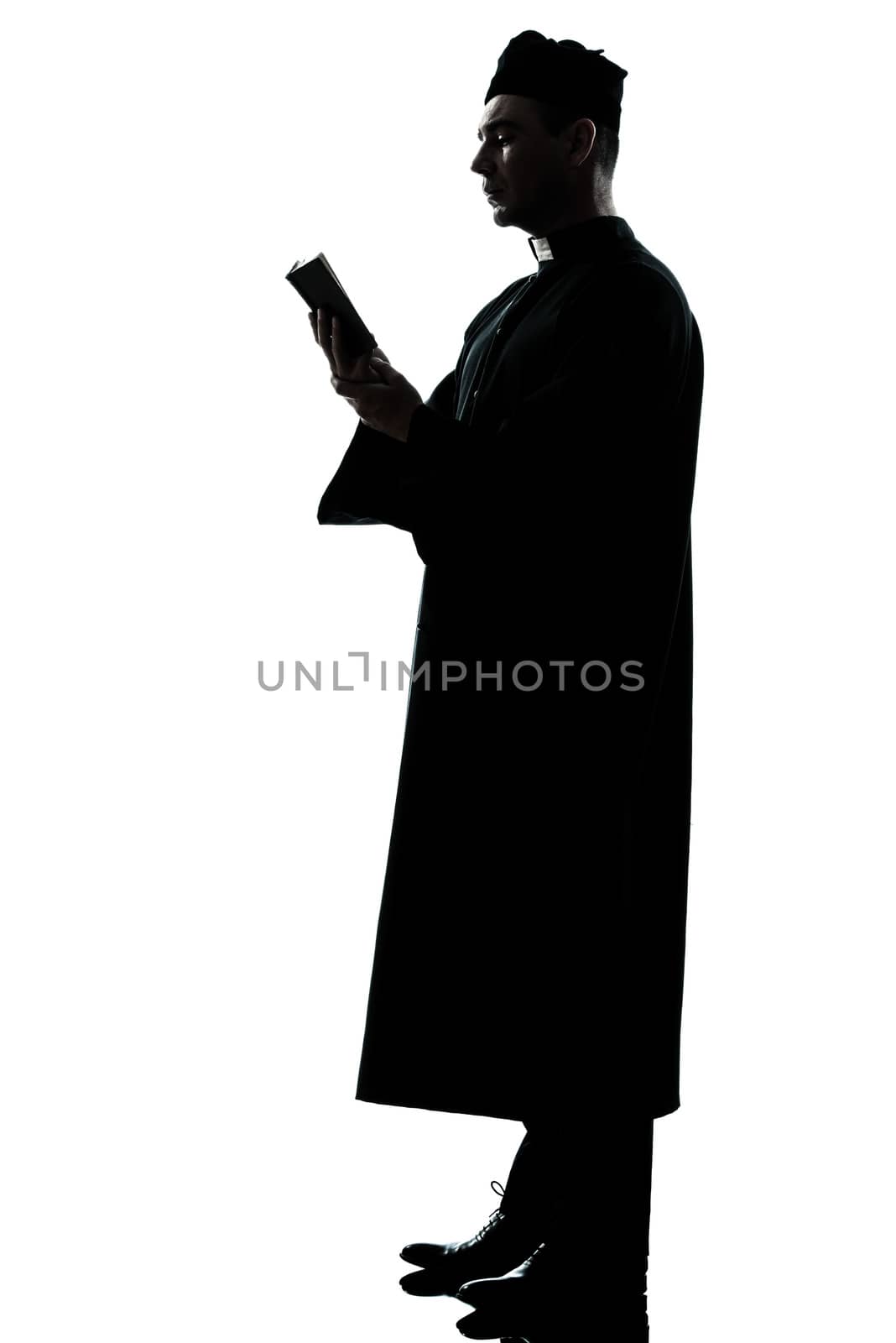 one  man priest reading bible silhouette in studio isolated on white background