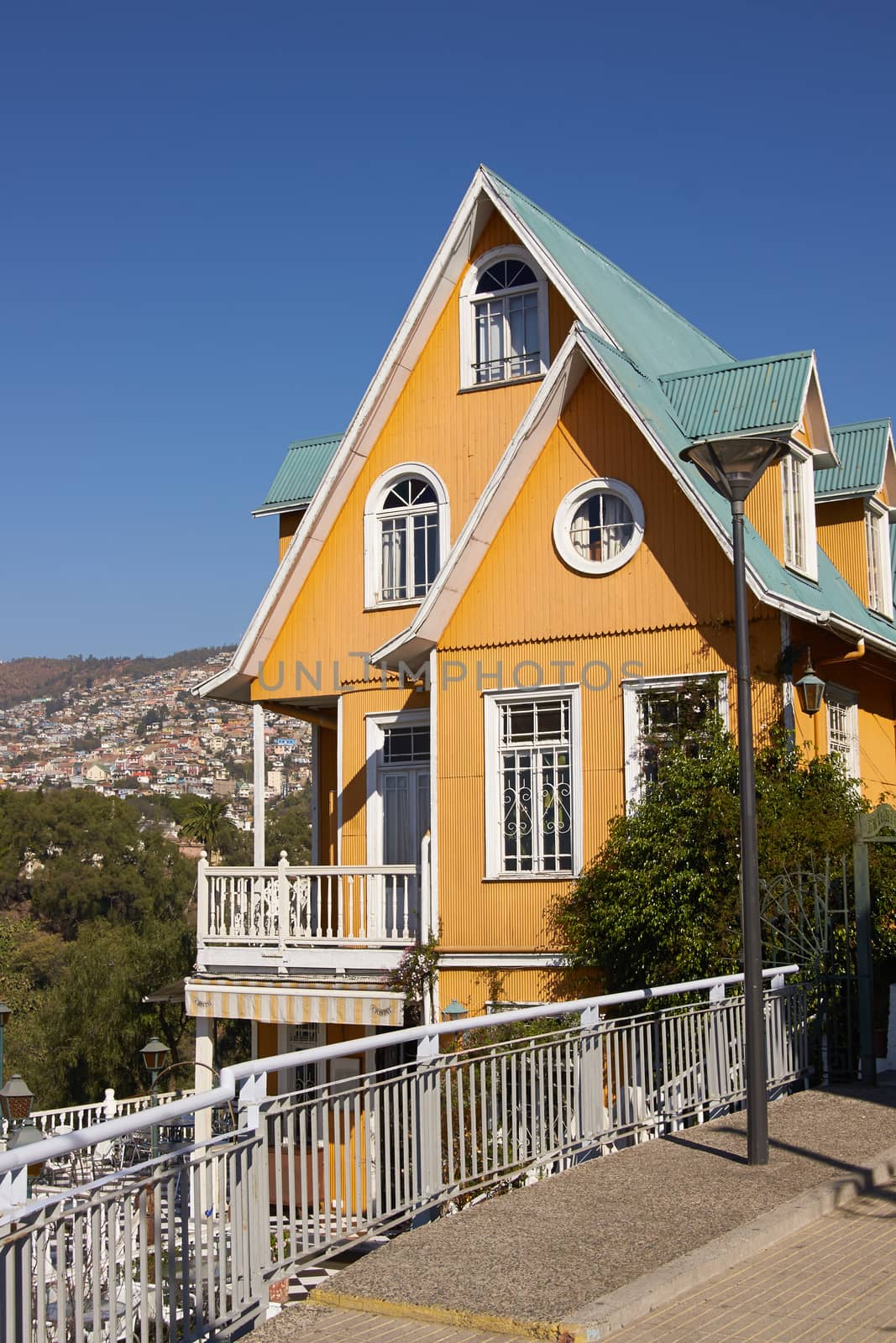 Colourfully painted house on a lookout in the hills above the harbour in the UNESCO World Heritage City of Valparaiso in Chile.