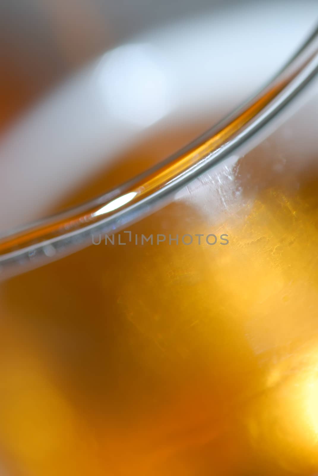 Close up of a Refreshing glass of beer showing rim of glass