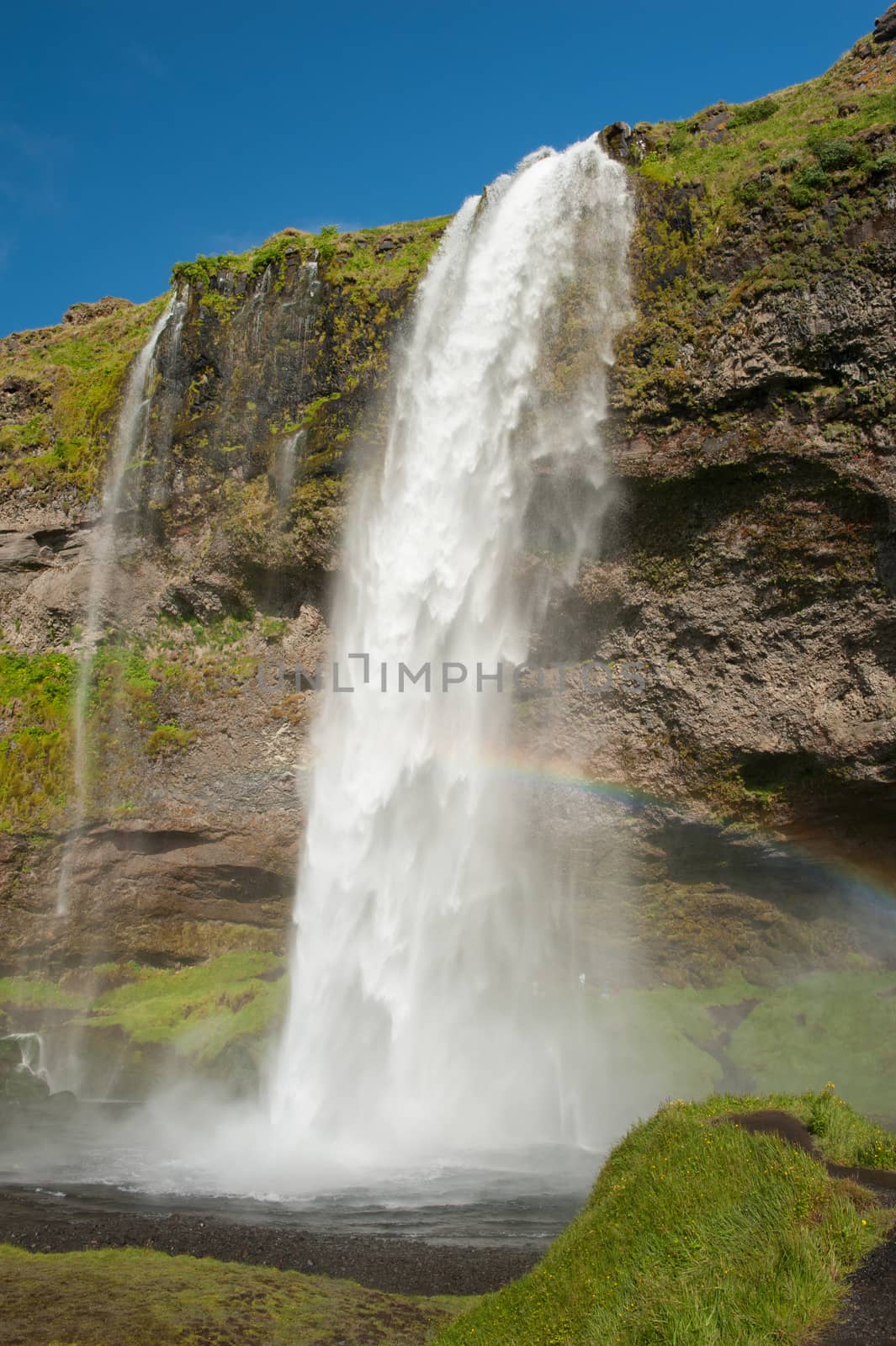 Seljalandsfoss is one of the most beautiful waterfalls on the Iceland. It is located on the South of the island. With a rainbow.